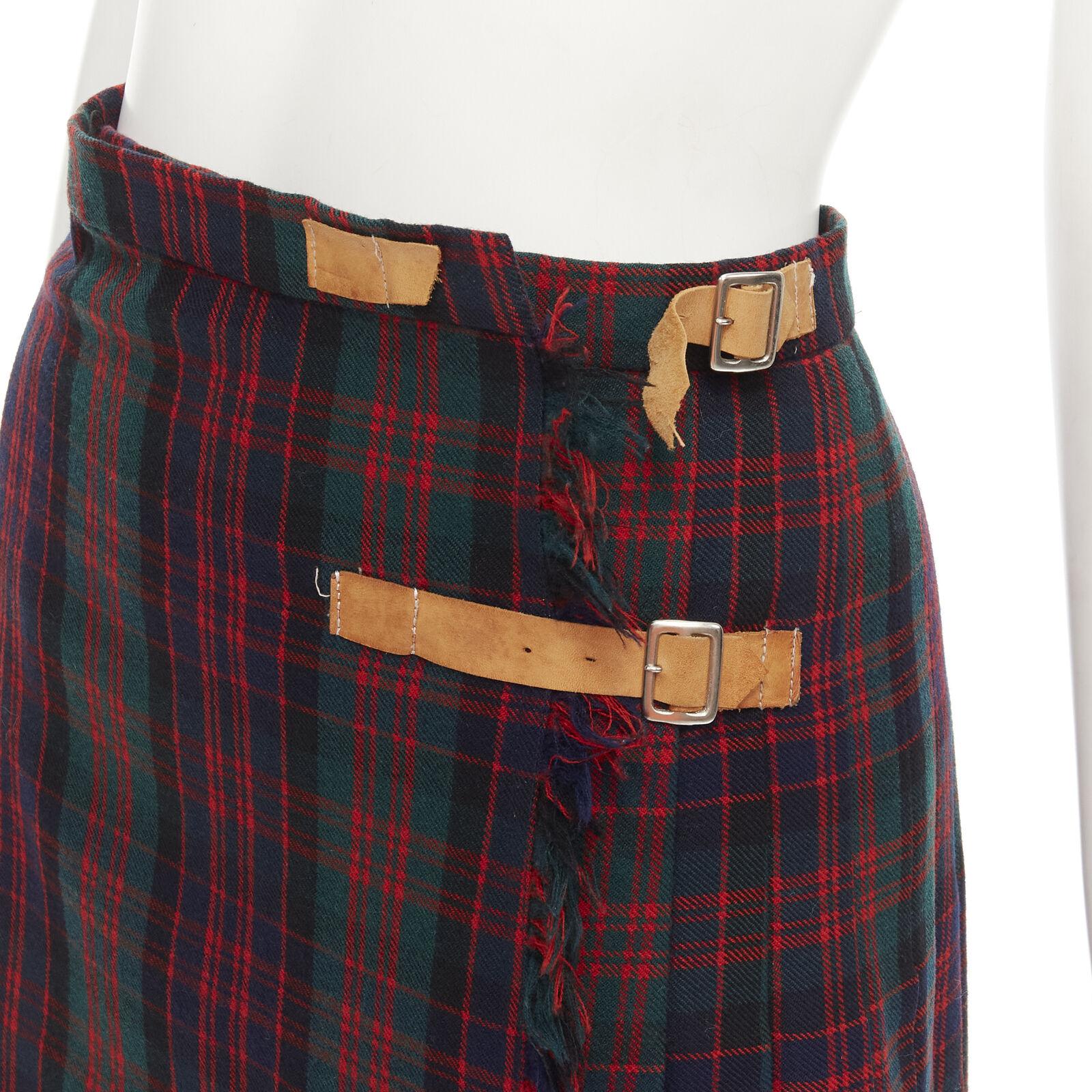 COMME DES GARCONS Vintage 1970's Punk red plaid leather buckles punk kilt skirt
Reference: CRTI/A00637
Brand: Comme Des Garcons
Designer: Rei Kawakubo
Collection: 1970s
Material: Feels like wool
Color: Red, Green
Pattern: Checkered
Closure: Snap