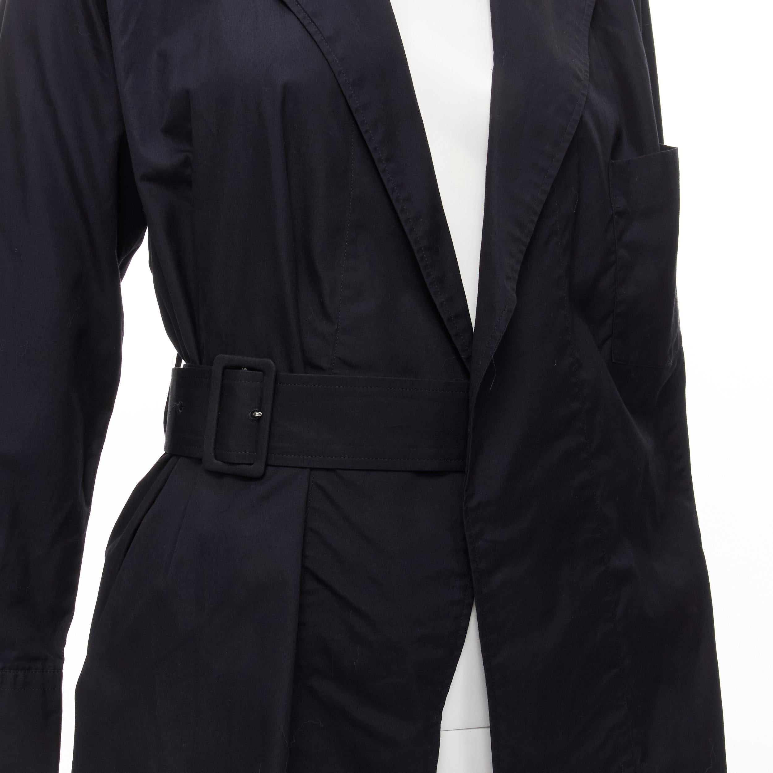 COMME DES GARCONS Vintage 1980s black cotton belted deconstructed blazer M 
Reference: CRTI/A00608 
Brand: Comme Des Garcons 
Designer: Rei Kawakubo 
Collection: 1980's 
Material: Cotton 
Color: Black 
Pattern: Solid 
Closure: Belted 
Extra Detail: