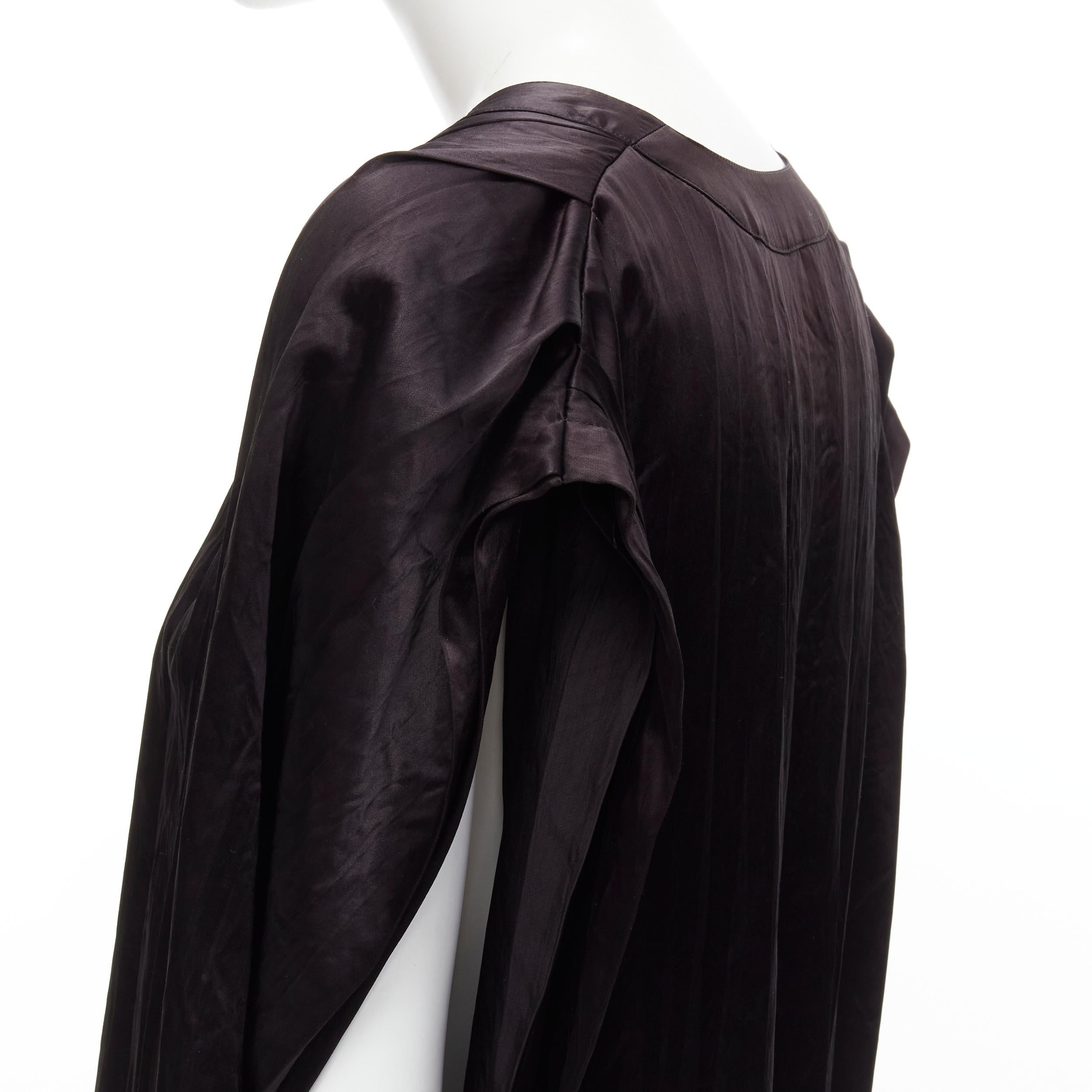 COMME DES GARCONS Vintage 1980s black triacetate V-neck oversized belted dress 
Reference: CRTI/A00548 
Brand: Comme Des Garcons 
Designer: Rei Kawakubo 
Collection: 1980's 
Material: Triacetate 
Color: Black 
Pattern: Solid 
Extra Detail: V-neck.