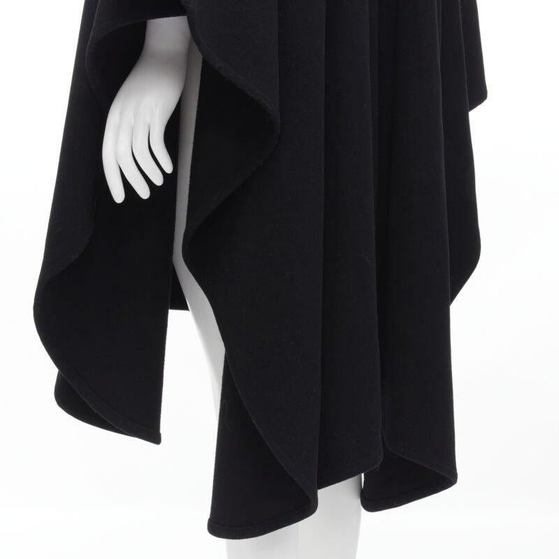COMME DES GARCONS Vintage 1980s black wool wide ruffle collar circle poncho cape
Reference: CRTI/A00549
Brand: Comme Des Garcons
Designer: Rei Kawakubo
Collection: 1980s
Material: Wool
Color: Black
Pattern: Solid
Extra Details: Circle cut draped