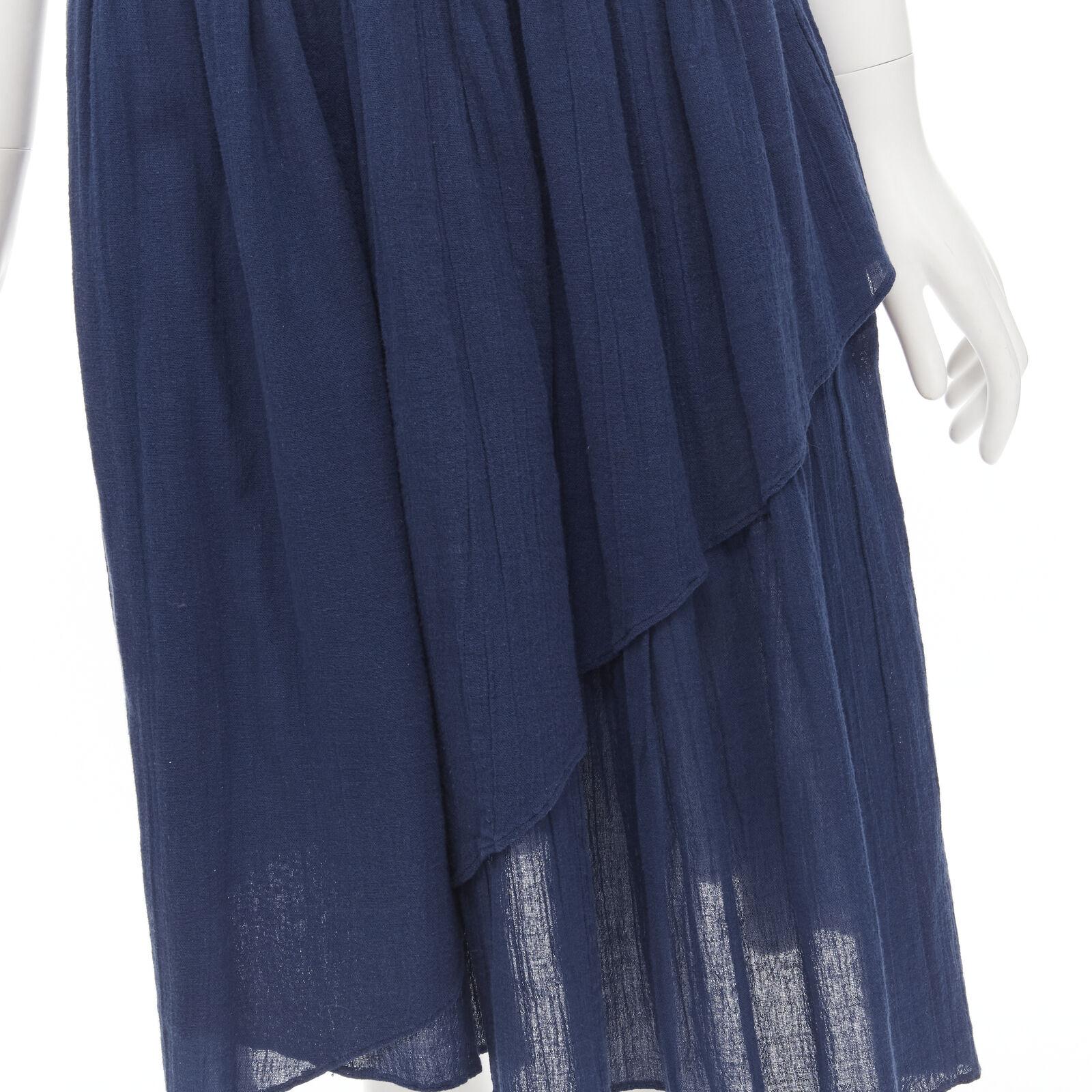 COMME DES GARCONS Vintage 1980's blue crinkled asymmetric waterfall draped skirt
Reference: CRTI/A00691
Brand: Comme Des Garcons
Designer: Rei Kawakubo
Collection: 1980s
Material: Cotton
Color: Blue
Pattern: Solid
Closure: Hook &