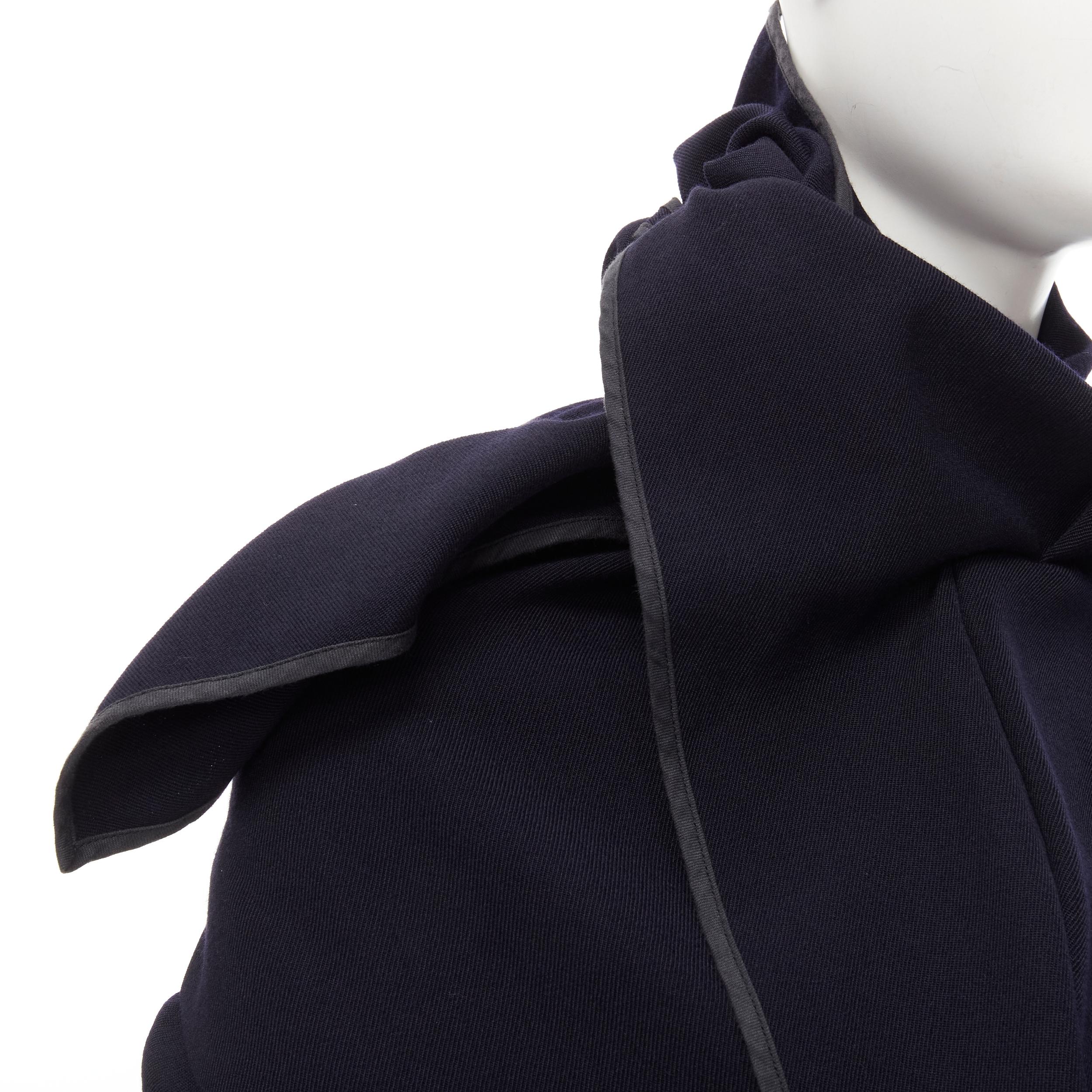 COMME DES GARCONS Vintage 1999 Runway dark navy wrapyped draped coat S 
Reference: CRTI/A00395 
Brand: Comme Des Garcons 
Designer: Rei Kawakubo 
Collection: 1999 Runway 
Material: Wool 
Color: Navy 
Pattern: Solid 
Extra Detail: Wrap front- metal