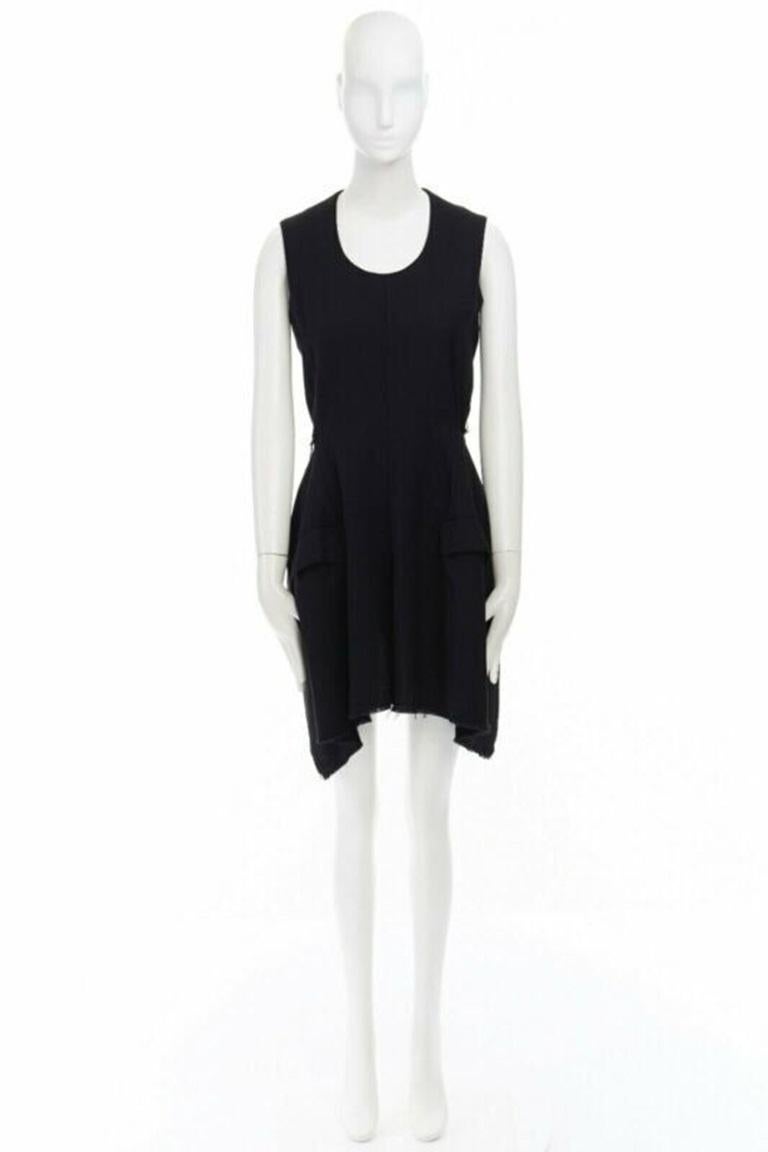 COMME DES GARCONS Vintage AW94 black wool raw edge slit sides tie back dress M
Reference: CRTI/A00048
Brand: Comme Des Garcons
Designer: Rei Kawakubo
Collection: AD1994
Material: Wool
Color: Black
Pattern: Solid
Closure: Zip
Extra Details: FROM THE