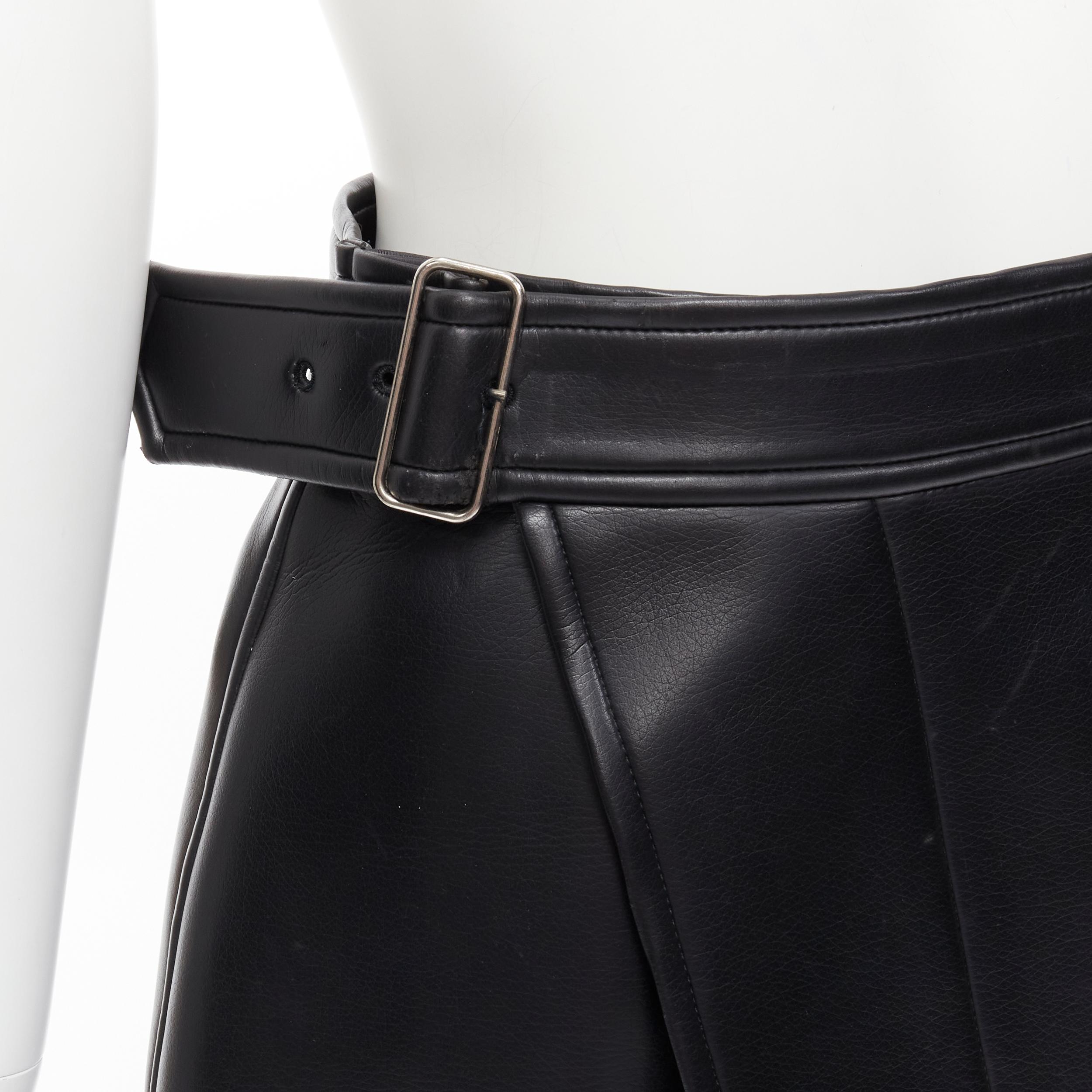 COMME DES GARCONS Vintage black faux leather silver buckle asymmetric skirt M 
Reference: CRTI/A00512 
Brand: Comme Des Garcons 
Designer: Rei Kawakubo 
Material: Faux Leather 
Color: Black 
Pattern: Solid 
Closure: Buckle 
Extra Detail: Silver-tone