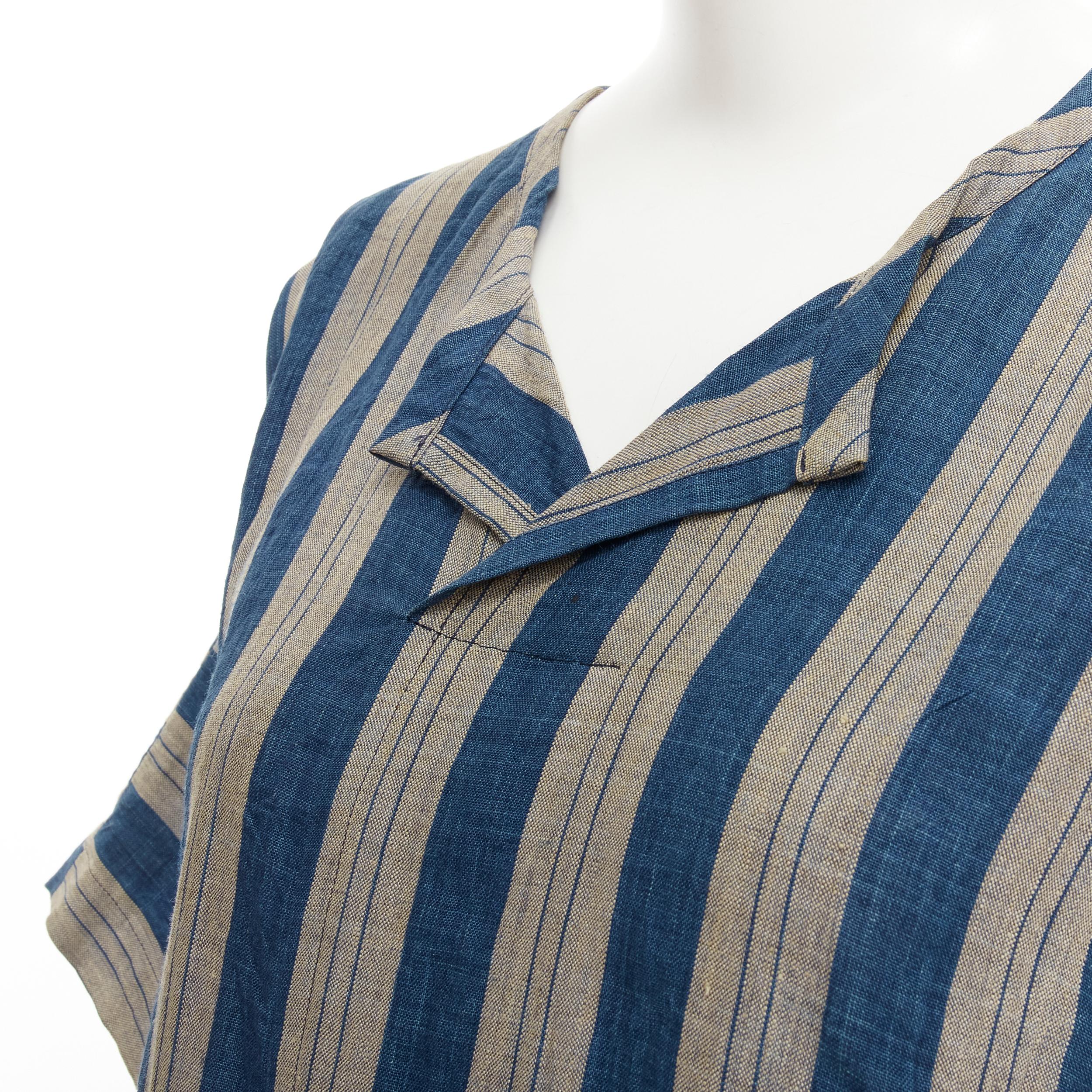 COMME DES GARCONS Vintage brown blue striped linen boxy fit shirt S 
Reference: CRTI/A00622 
Brand: Comme Des Garcons 
Designer: Rei Kawakubo 
Material: Linen 
Color: Brown 
Pattern: Striped 
Extra Detail: Spread collar. One-piece sleeve. Boxy fit.