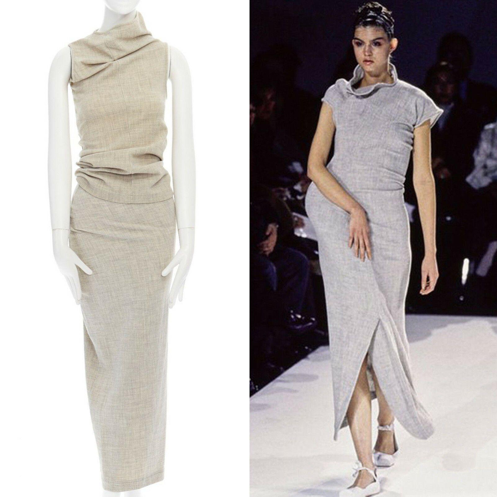 COMME DES GARCONS Vintage SS1997 Lumps & Bumps grey asymmetric top skirt M US6
COMME DES GARCONS
FROM THE ICONIC 1996 LUMPS AND BUMPS COLLECTION
WOOL, NYLON, POLYURETHANE . 
LIGHT GREYISH BEIGE . 
ASYMMETRIC CUT NECKLINE AND SLEEVES . 
SEA M DOWN