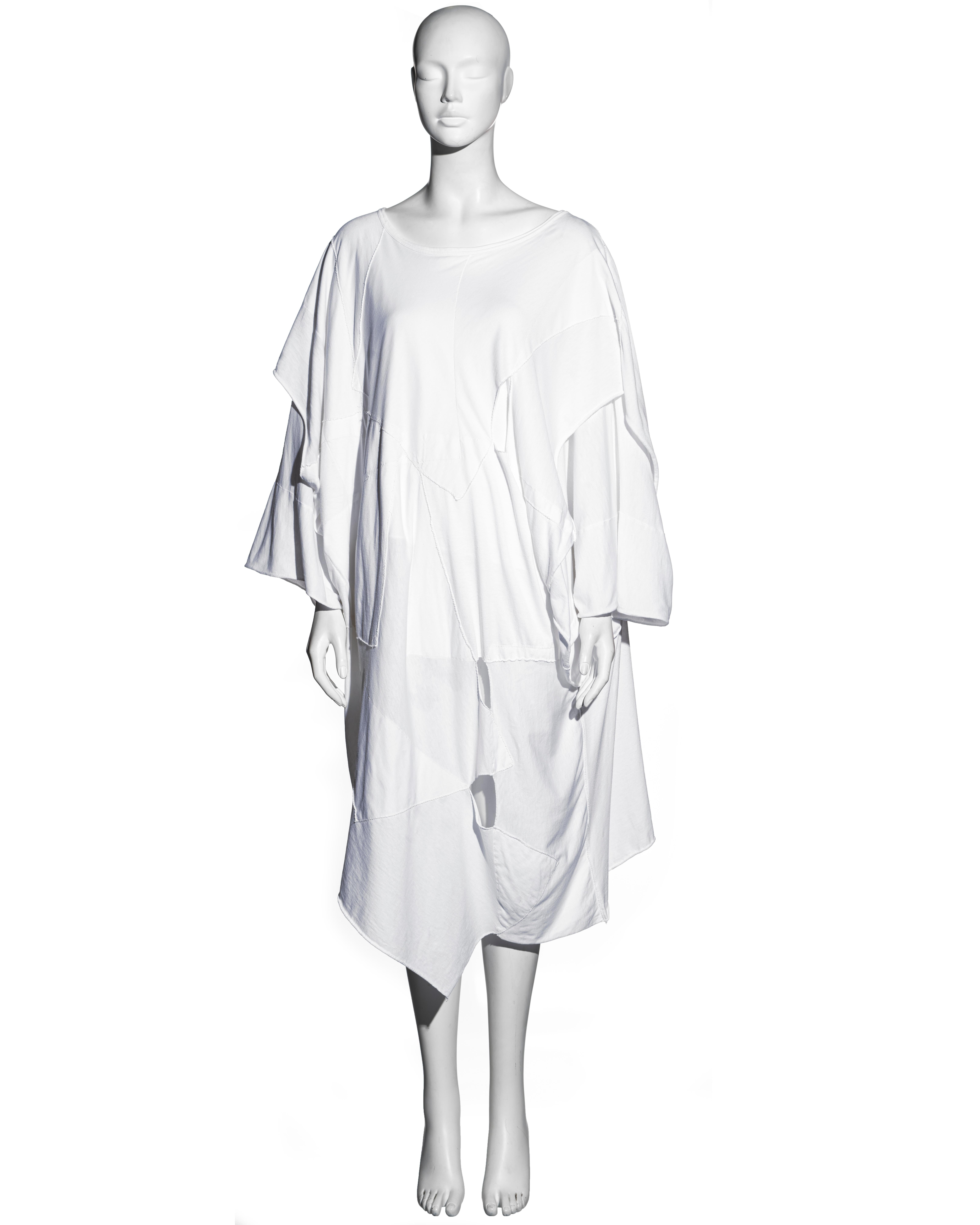 ▪ Comme des Garcons white oversized patchwork t-shirt dress
▪ 100% cotton
▪ Double layered 
▪ Scoop neck 
▪ Wide-cut 
▪ Irregular seams and slits throughout 
▪ One Size
▪ Spring-Summer 1983