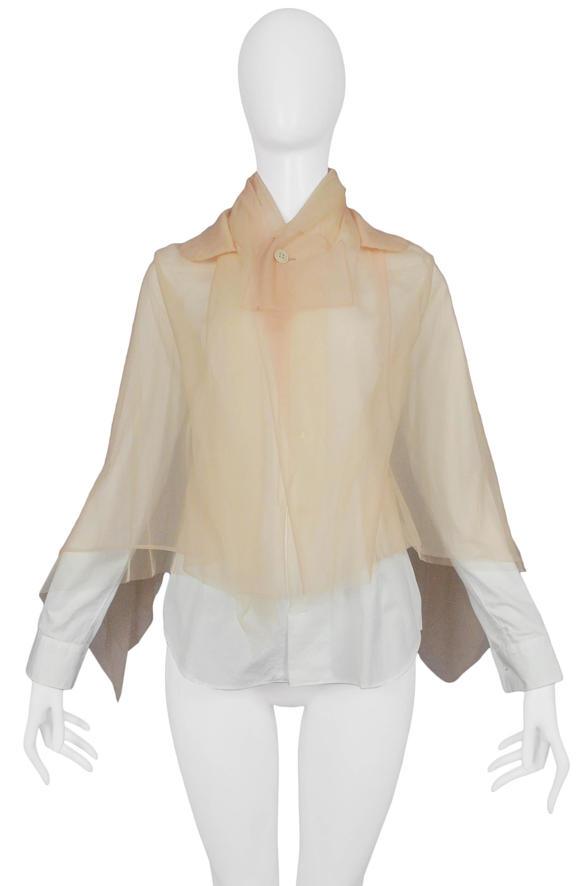 Resurrection Vintage is excited to offer a vintage Comme des Garcons white button-down shirt with nude shawl mesh overlay. From the 2009 collection. 

Comme Des Garcons
Size: XS
Fabric: Mesh & Woven
2009 Collection
Excellent Vintage Condition