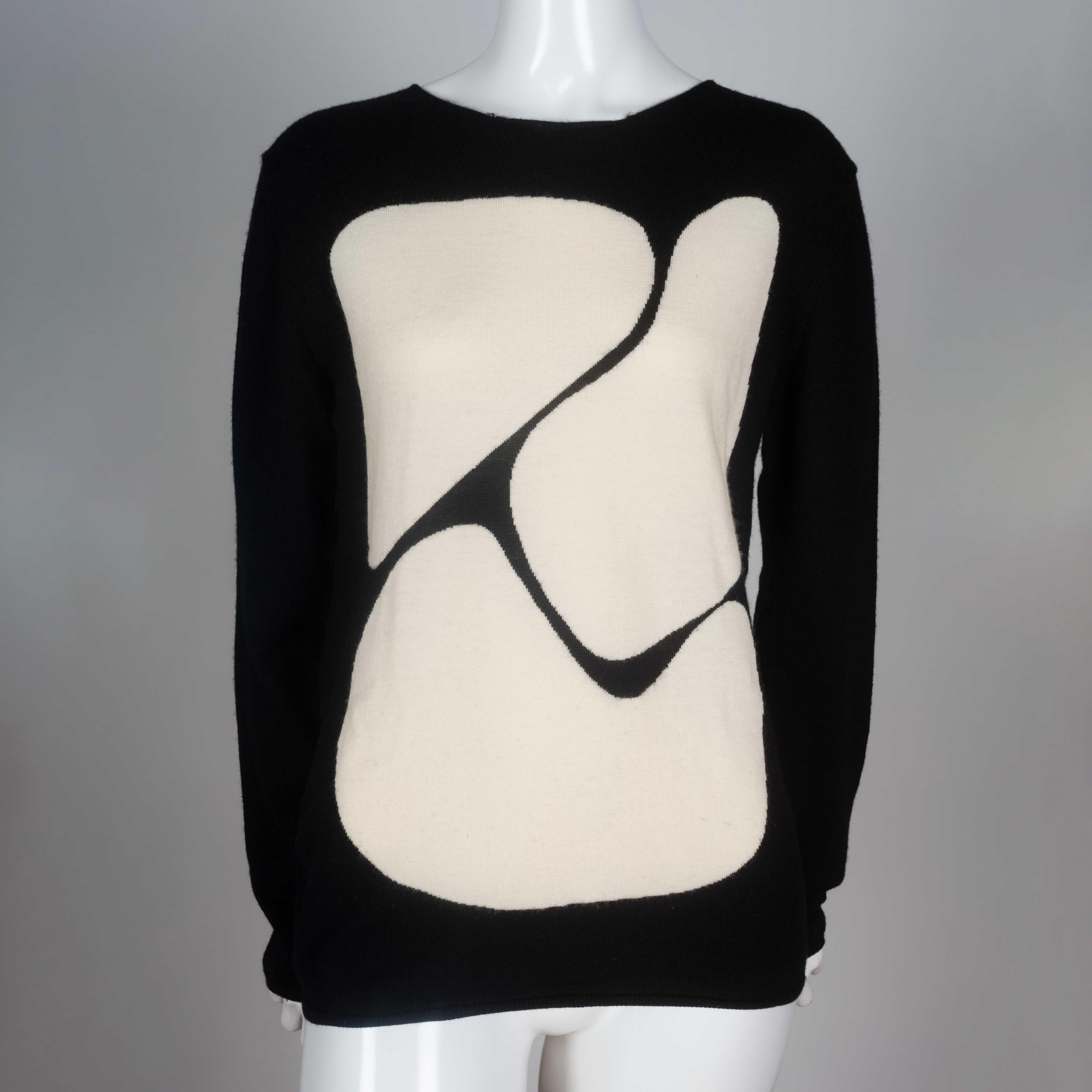 Comme des Garcons black, long sleeve wool shirt with off-white abstract shapes design. 

YEAR: Unknown
MARKED SIZE: S
US WOMEN'S: M
US MEN'S: S
FIT: Regular
CHEST: 18