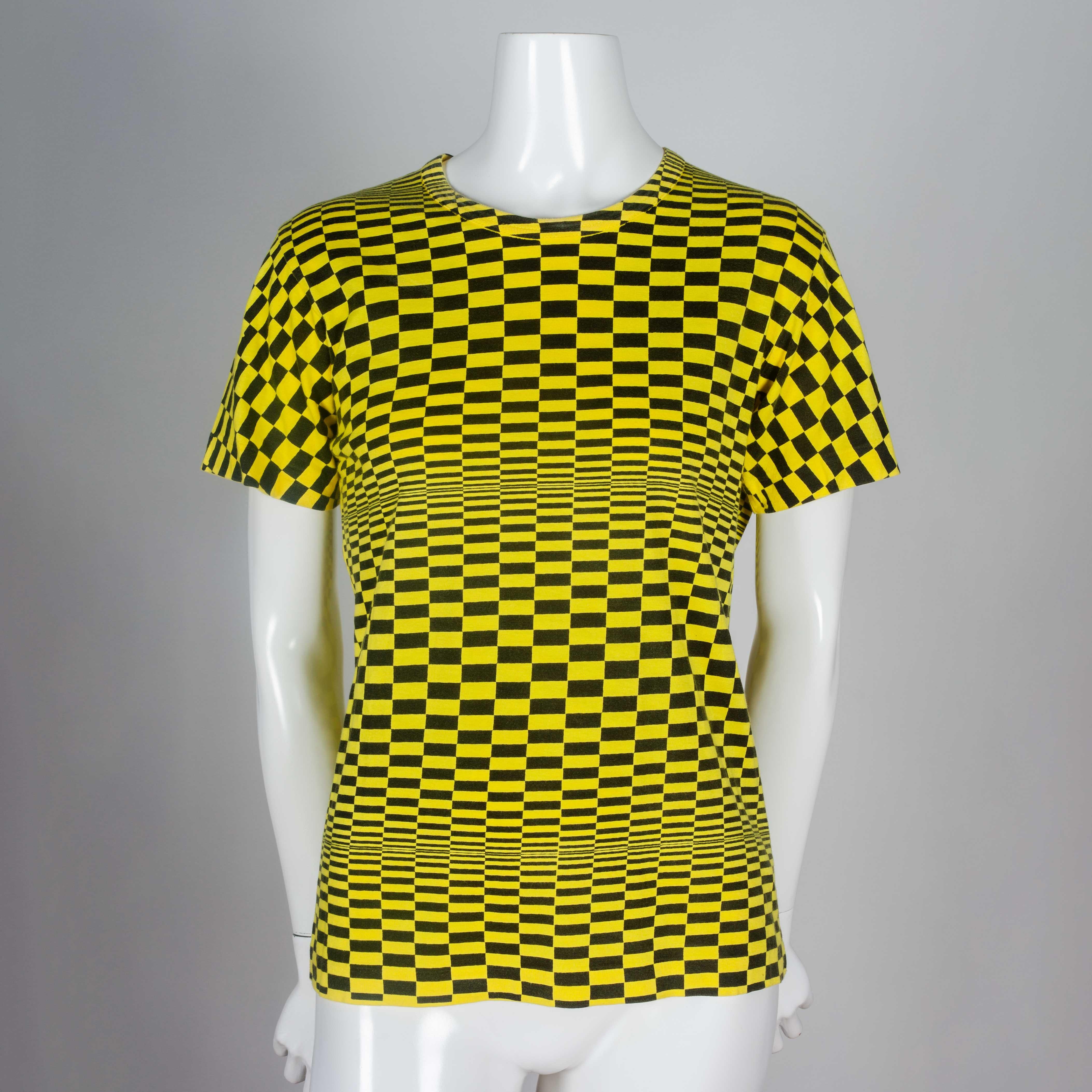 Comme des Garçons 2000 neon yellow and black cotton tee from Japan, screen-printed with checker pattern. Techno feel. The horizontal bands of checkers have varying sizes, creating an optical illusion of movement. An ultra visual sensory tee that