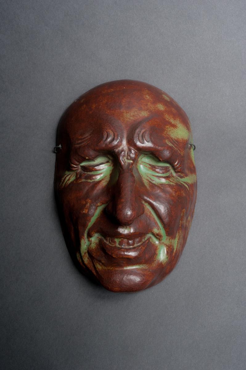 Exploring new firing and glazing techniques and their myriad effects on traditional forms was an exciting approach for many experimental turn-of-the-century ceramists. Here the acid green and dark umber glaze takes on the quality of copper patina.
