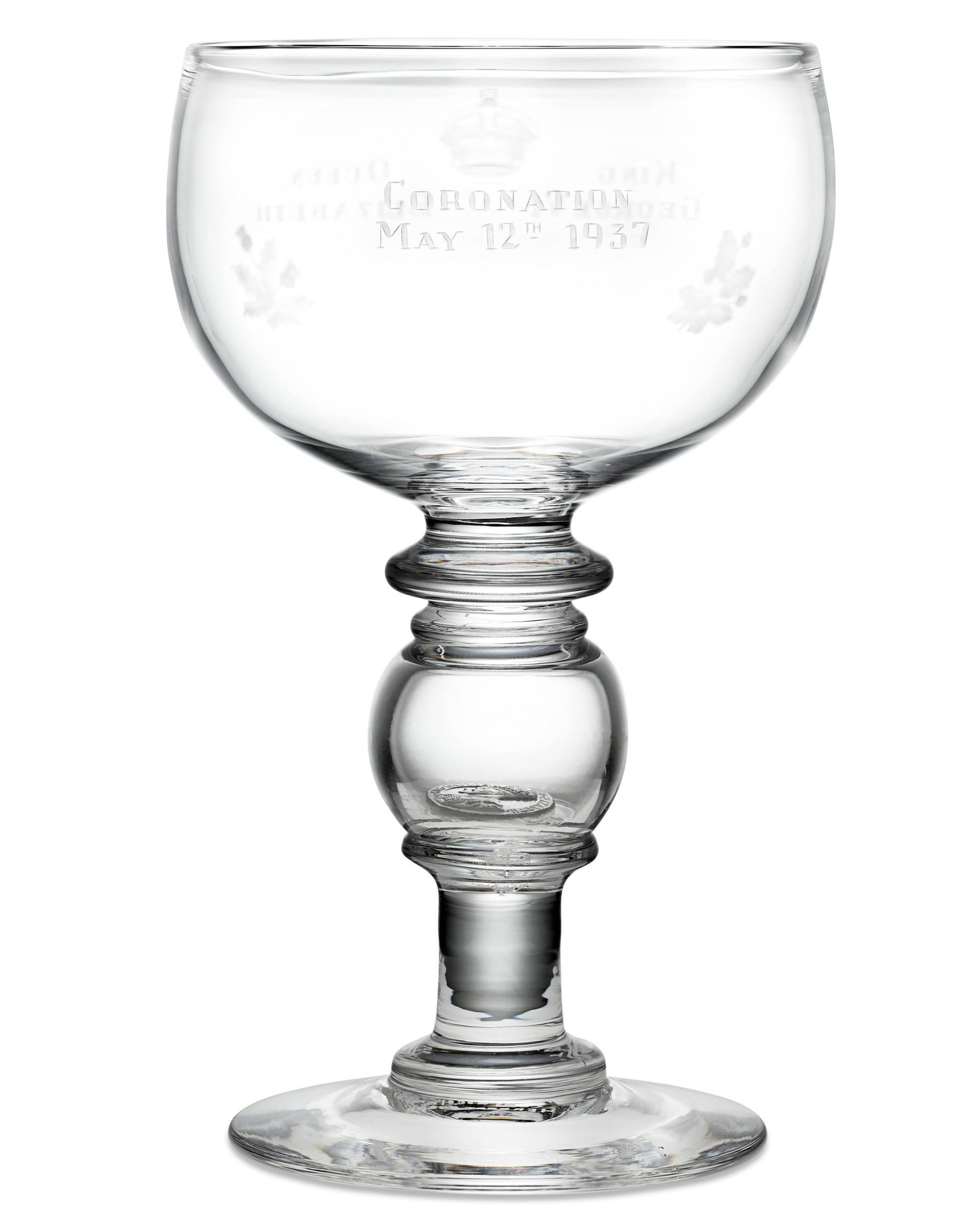 This elegantly formed glass goblet was crafted specifically to celebrate the coronation of Britain's King George VI and Queen Elizabeth. The cup's bowl is inscribed on either side with the royals' names and the date of their coronation, May 12th,