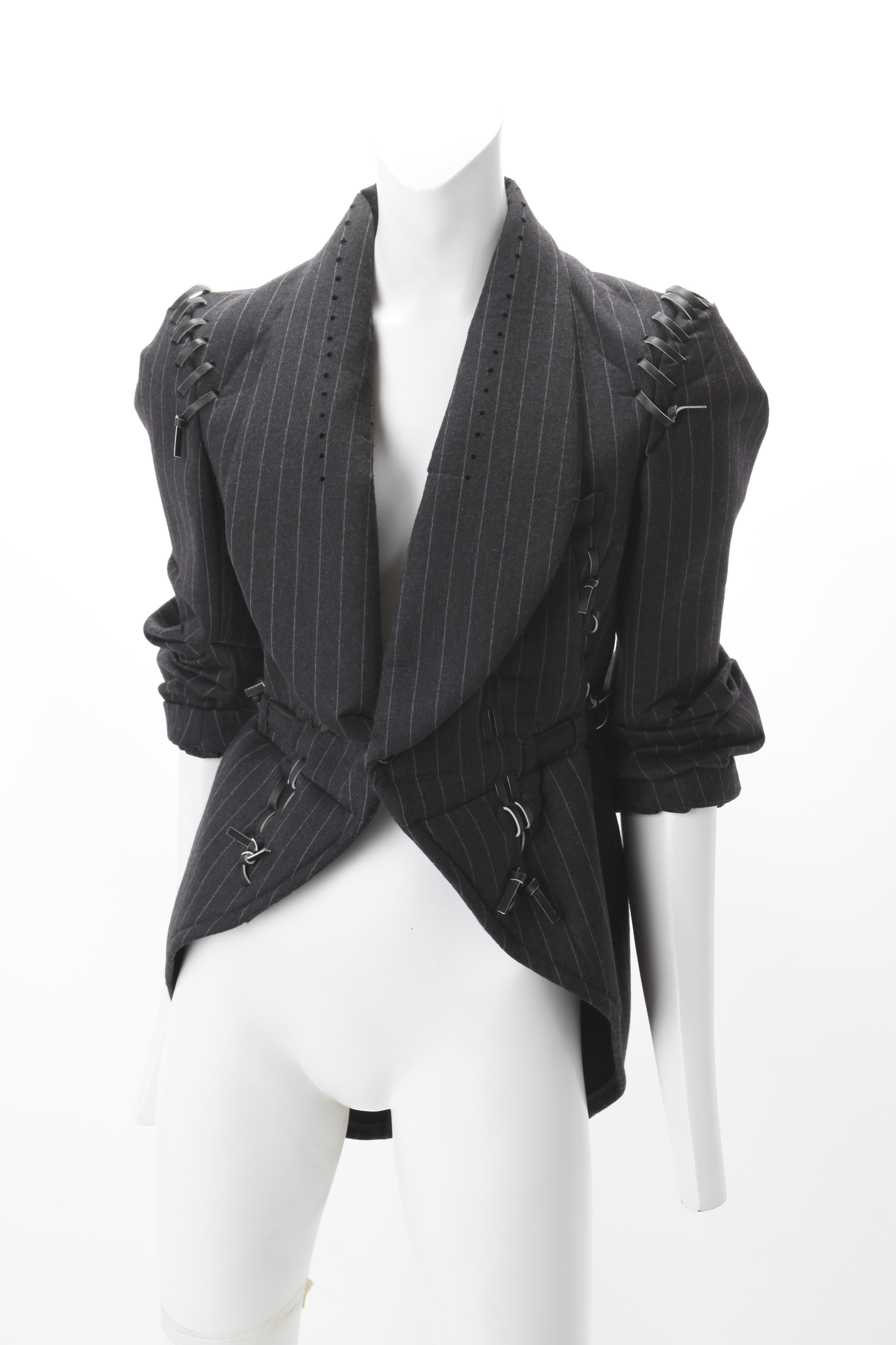 Commes des Garcons Corset Jacket w/ Leather Ties 2004 

Gray wool pinstripe Jacket with leather corset ties throughout; Tails with vent at back; single button fastening at front waist.  Fits US sz 4 