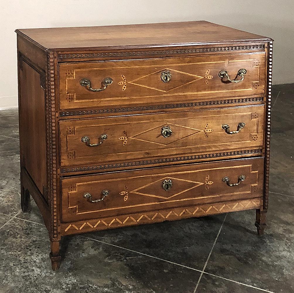 Commode, 18th century Swiss Louis XVI inlaid fruitwood. This gem is a remarkable feat of rural craftsmanship, all handmade by talented artisans from local indigenous woods. Starting with a casework of fruitwood, charming embellishments were inlaid
