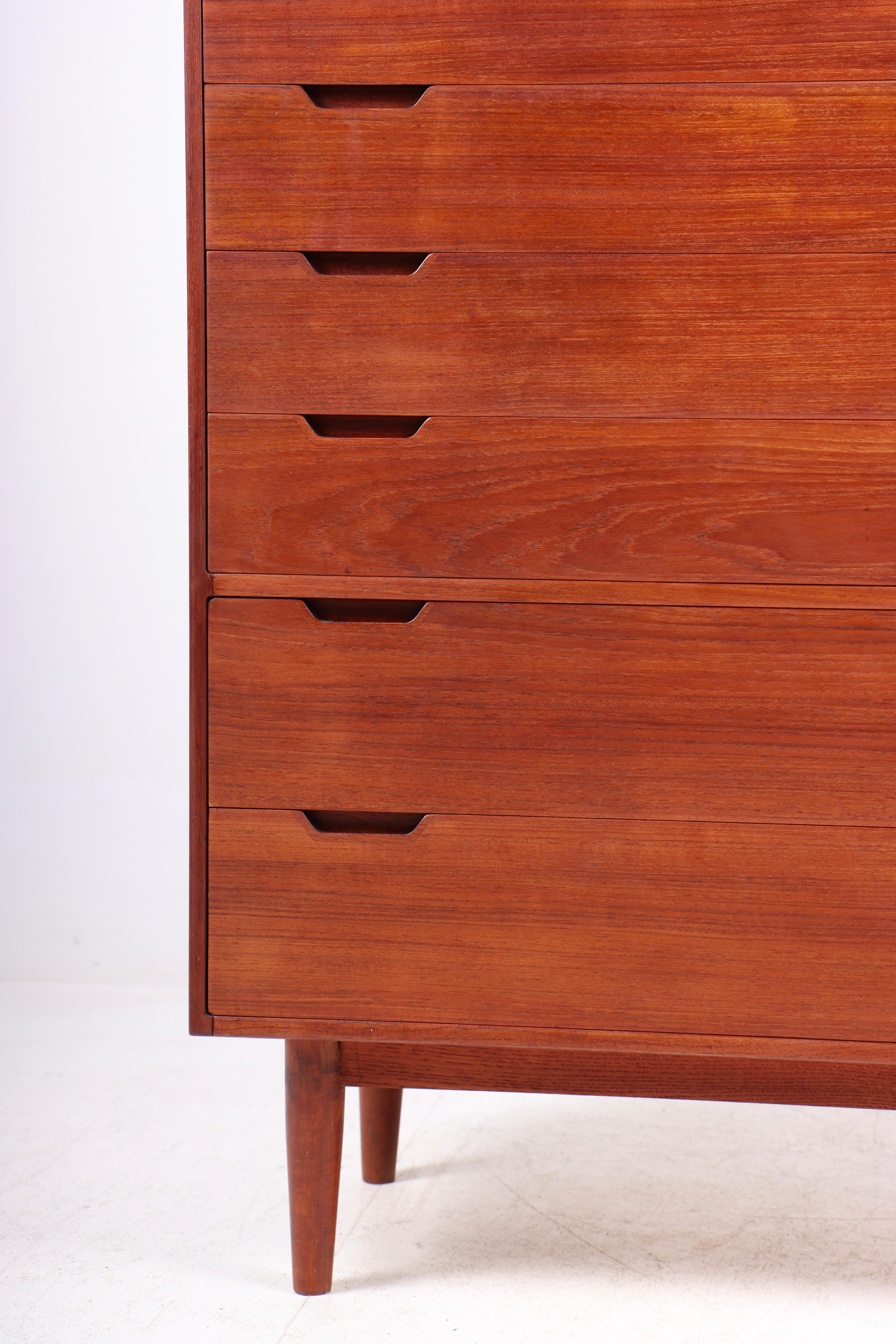 Elegant commode in teak designed by Svend Langkilde M.A.A. Made in Denmark, circa 1965. Great original condition.