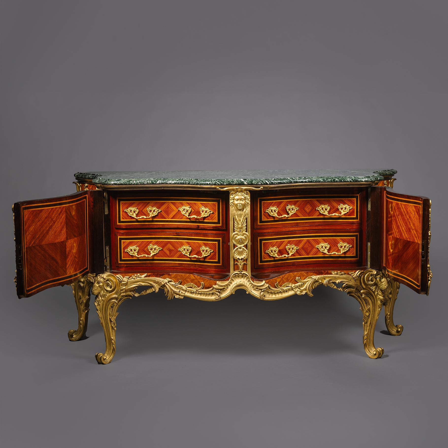 A Magnificent Gilt-Bronze Mounted Parquetry Commode, After Antoine Gaudreaux's 'Commode Médallier'. 

The serpentine Vert Maurin marble top above a conforming case set with two cupboard doors each decorated with lozenge parquetry. The interior