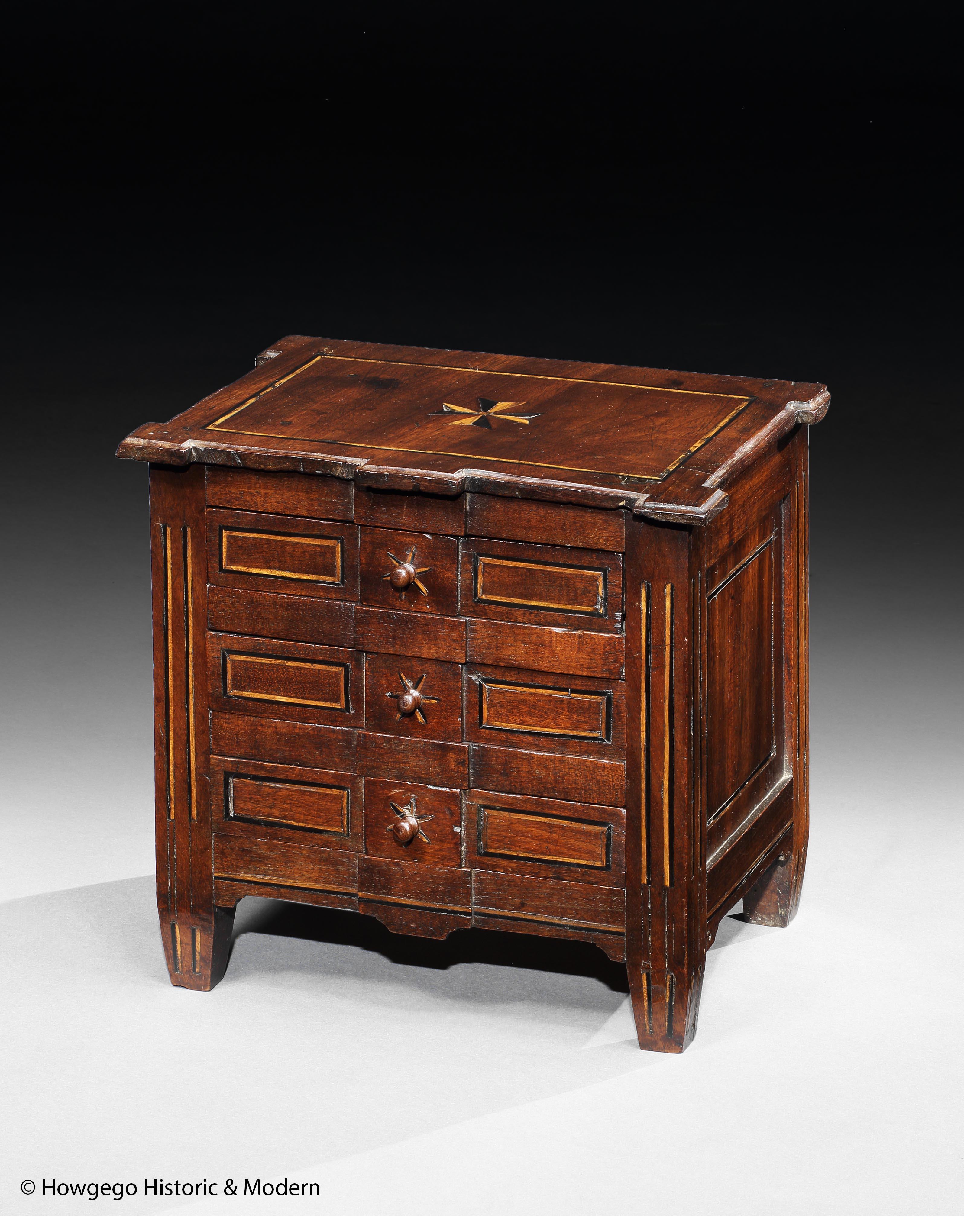 An exceptionally rare, museum quality Maltese, Neoclassical walnut chest of drawers with ebonised & fruitwood inlaid maltese cross on the top and drawer fronts

Maltese furniture of this period is exceptional reflecting the status and affluence of