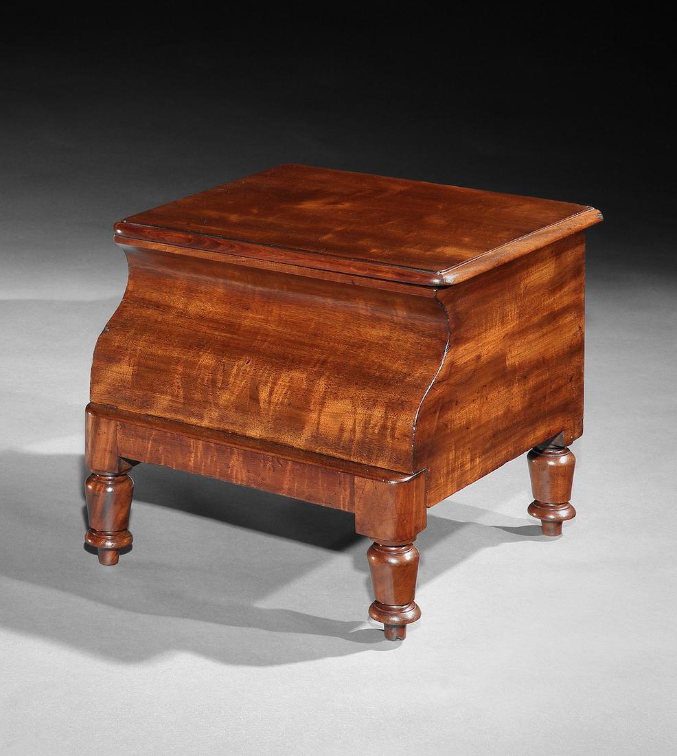 - Stunning plum pudding veneers, colour and patina.
- Perfect height for a sofa table, or bedside
- Unusual scroll-shaped front 
- Striking conversation piece

Particulary fine 19th century mahogany commode with a scroll-shaped front and original