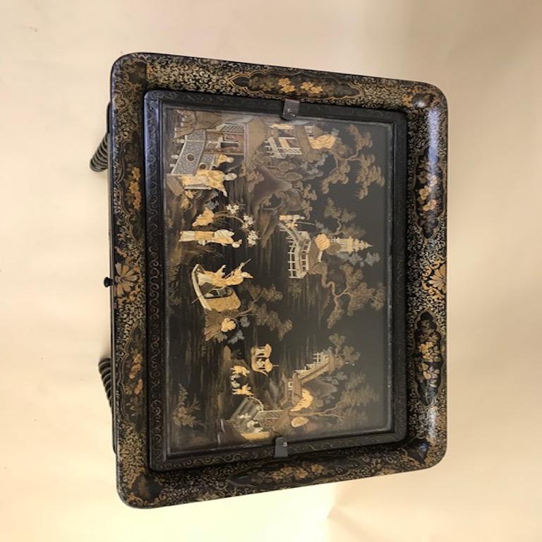 Raised chinoiserie painting. Central top tray with glass. Two side extensions. Turned spindle legs and stretcher. Central drawer with original hardware.