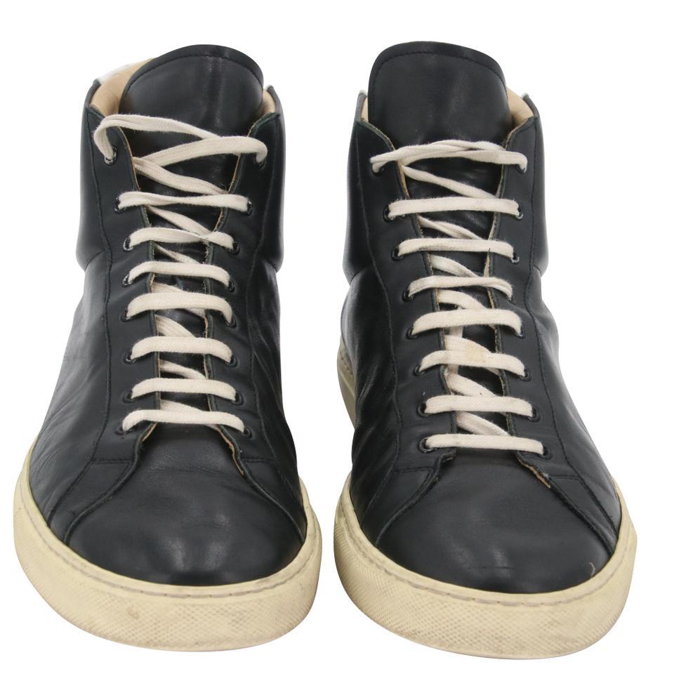 Common Projects Leather Achilles Retro High Top Men's Sneakers Size 42/9

Black leather Achilles Retro High sneakers from Common Projects featuring an ankle length, a lace-up front fastening, a round toe, a flat rubber sole and a gold-tone serial