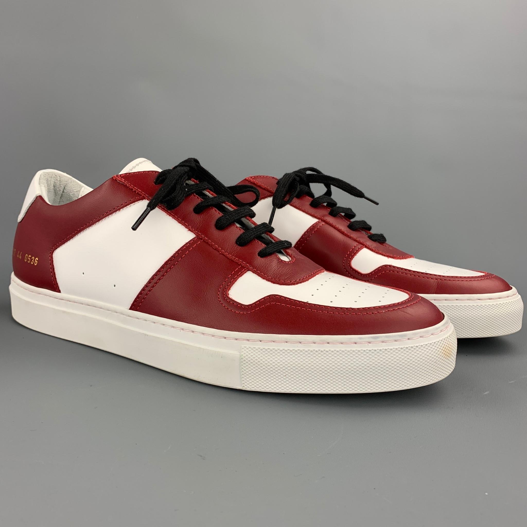 COMMON PROJECTS shoes comes in a white & burgundy leather featuring a rubber sole and a lace up closure. Made in Italy. 

Very Good Pre-Owned Condition.
Marked: EU 44

Outsole:

12 in. x 4 in. 