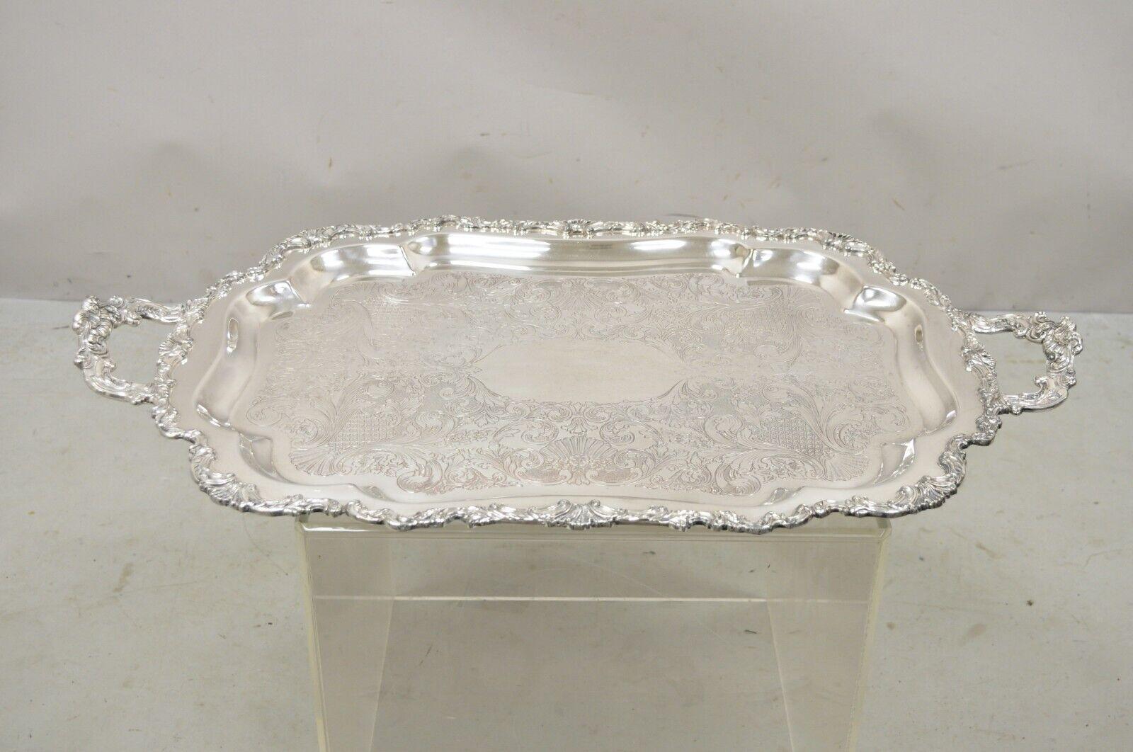Vintage Community Ascot 0316-10 Silver Plated Ornate Twin Handle Serving Platter Tray. Item features large impressive size, ornate twin handles, shapely scalloped form. Circa Mid 20th Century. Measurements: 2