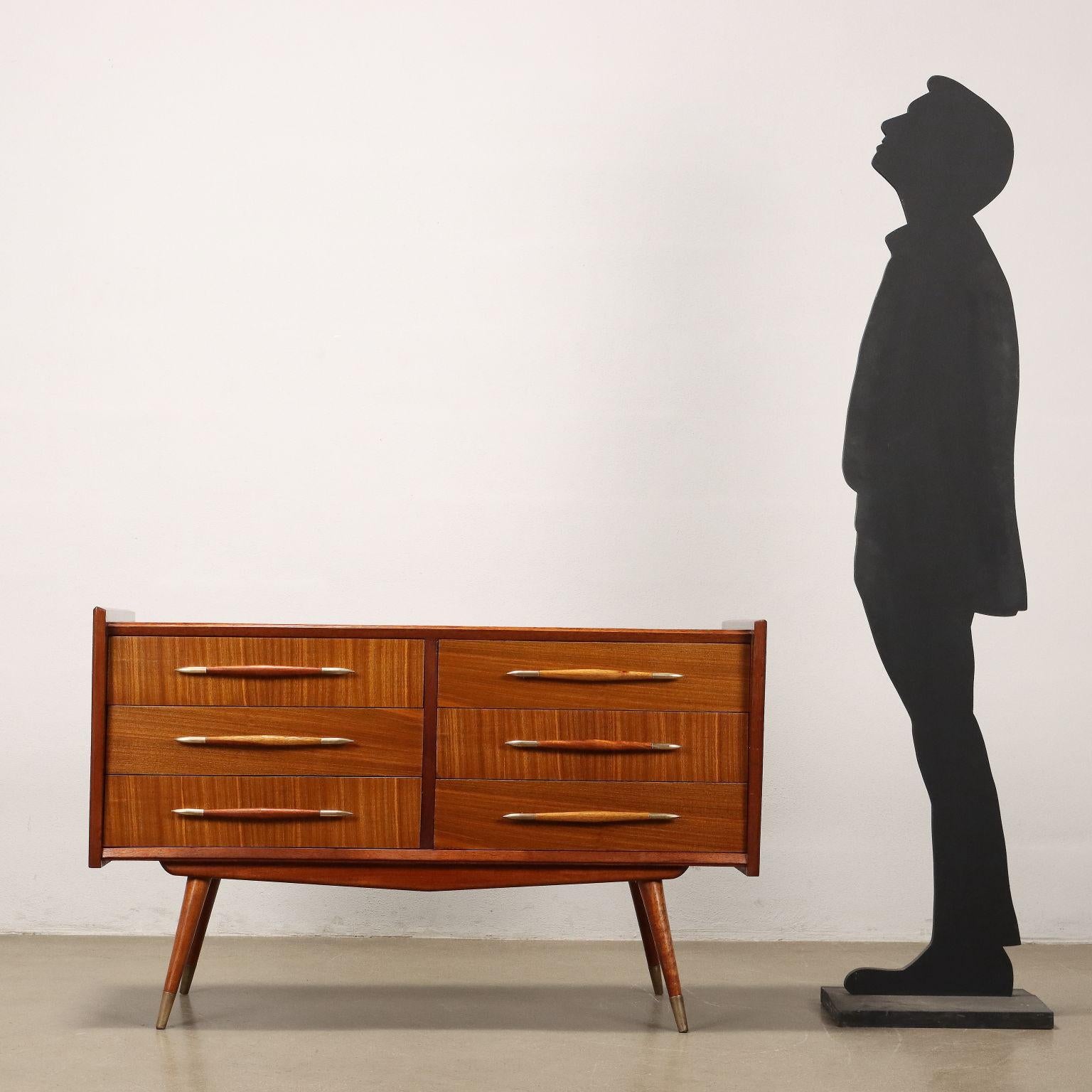 South American-made wooden dresser from the 1950s, with six drawers embellished with brass ferrules as well as on the legs. Restaurato.