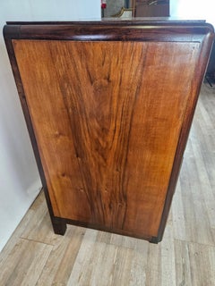 Art Deco five-drawer walnut and mahogany dresser with brass handles