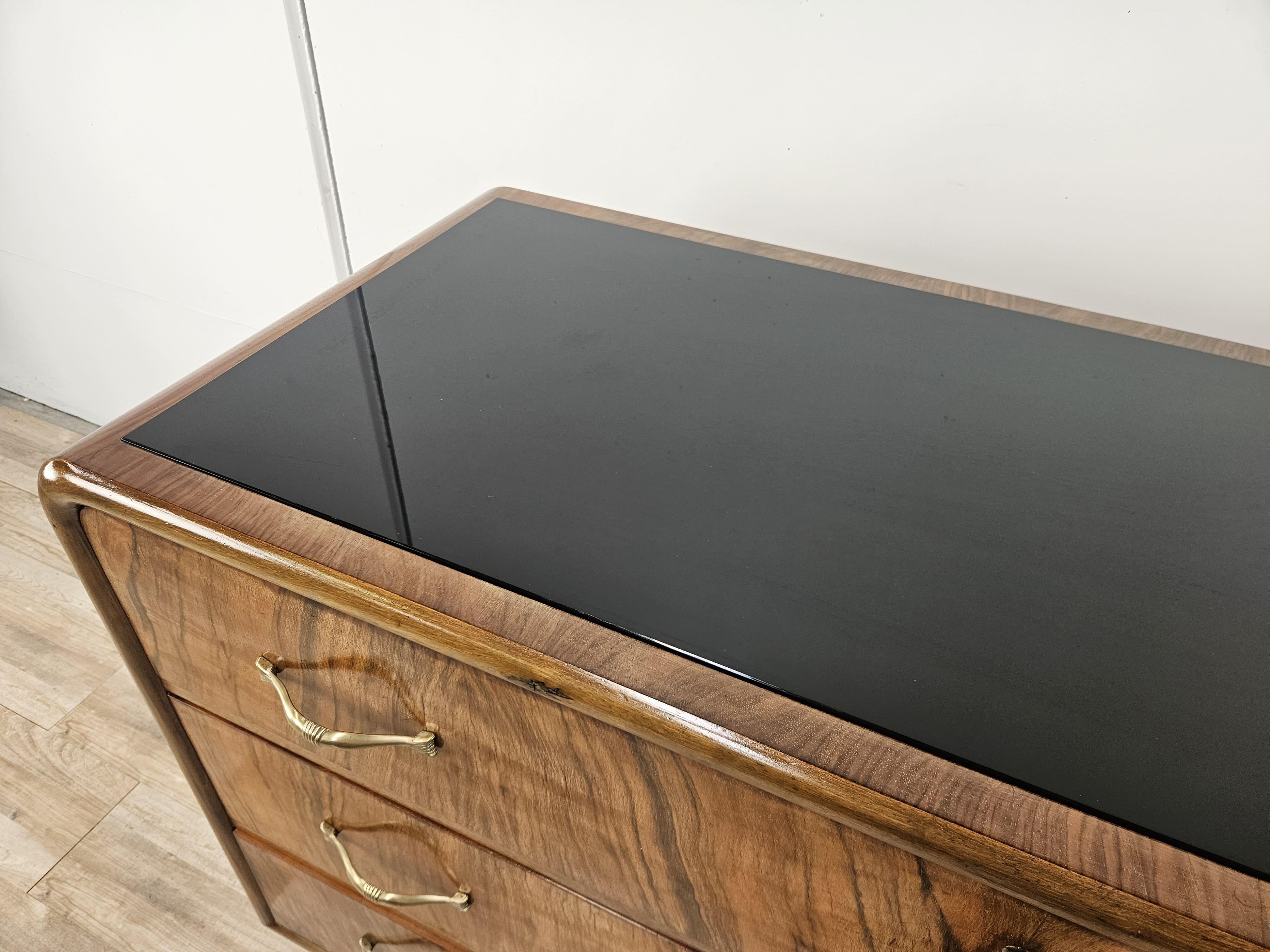 Brass Art Deco walnut burl dresser with black glass top and brass handles For Sale