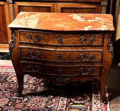 Chest of drawers with bronze inlays, circa 1920.