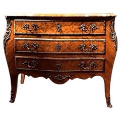 Chest of drawers with bronze inlays, circa 1920.