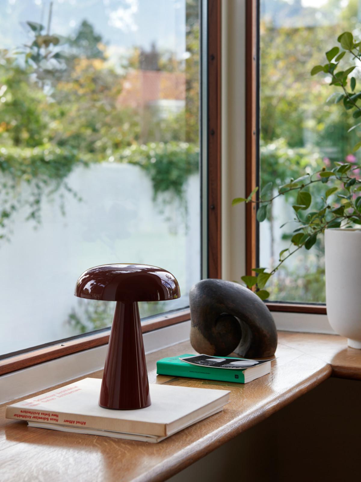 Match lighting to mood with Como SC53, a portable table lamp from Space Copenhagen. 
Crafted from anodized aluminium, Como’s sturdy base tapers up towards a softy curved, mushroom-shaped shade. 
This battery-powered lamp can operate for eleven