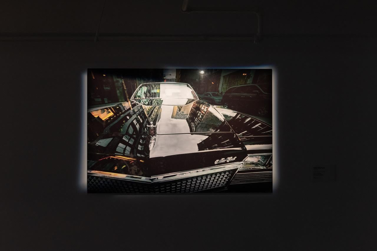 Part of the Reflections collection released by Spanish photographer Cuco de Frutos in 2019. This original photograph captures the imposing, angular city of New York, reflected upon the hood of the car, tying together ideals of strength, power and