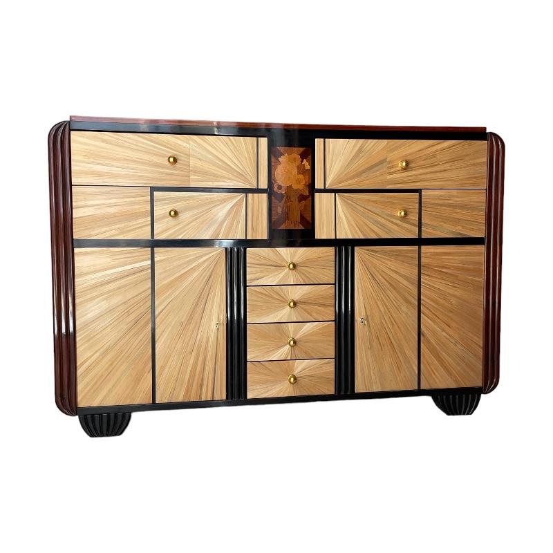 
Large Art Deco chest of drawers or buffet in rosewood and straw marquetry, beautiful floral marquetry of different exotic woods. Rare piece from the transition period and early French Art Deco, piece made according to the canons of cabinetmakers