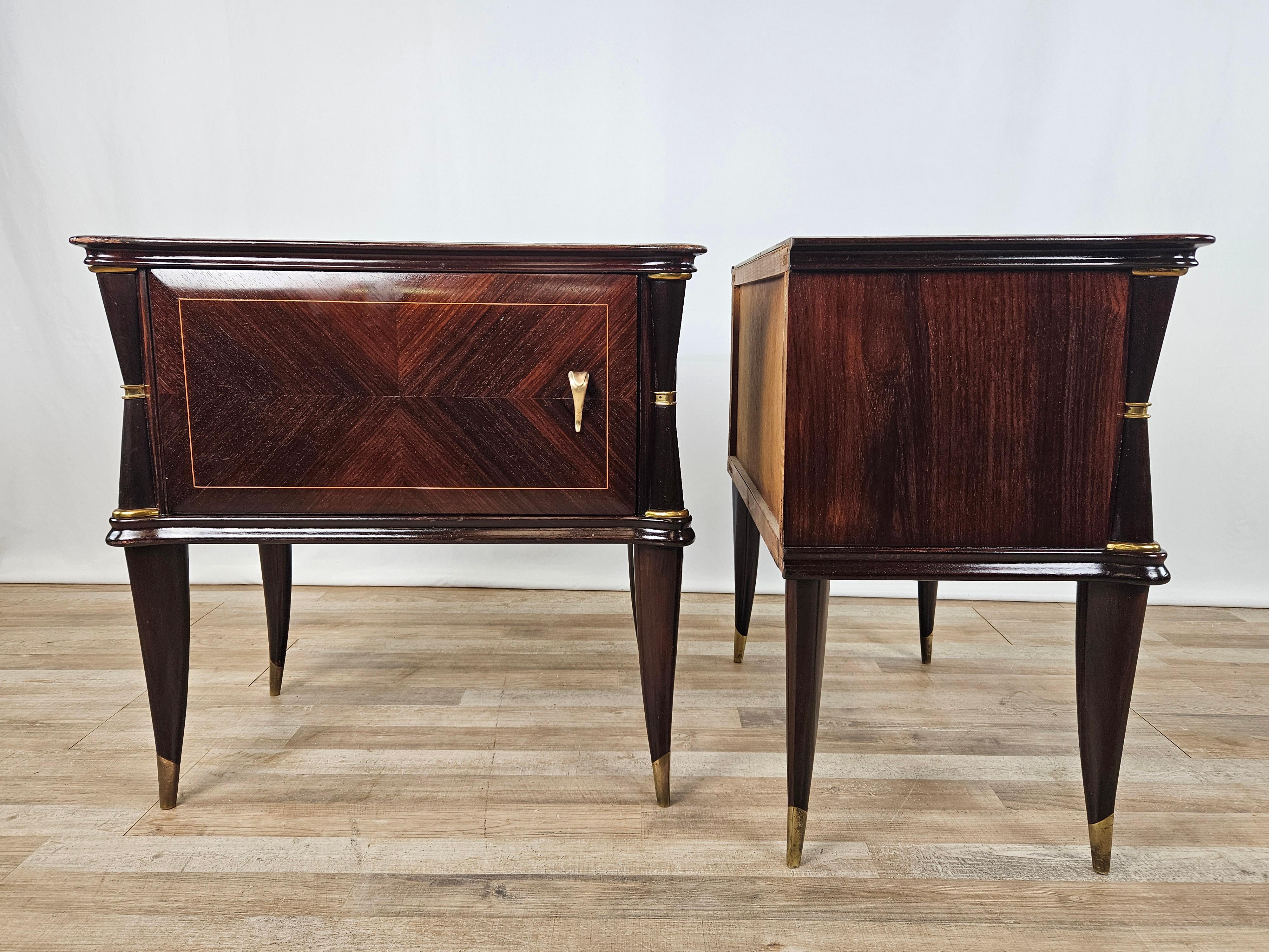 Elegant pair of bedside tables with special brass details and rosewood profiles, decorated glass top.

The frame is mahogany burl with maple threading along the doors and rosewood edges and legs.

They have been oil polished, show normal signs due