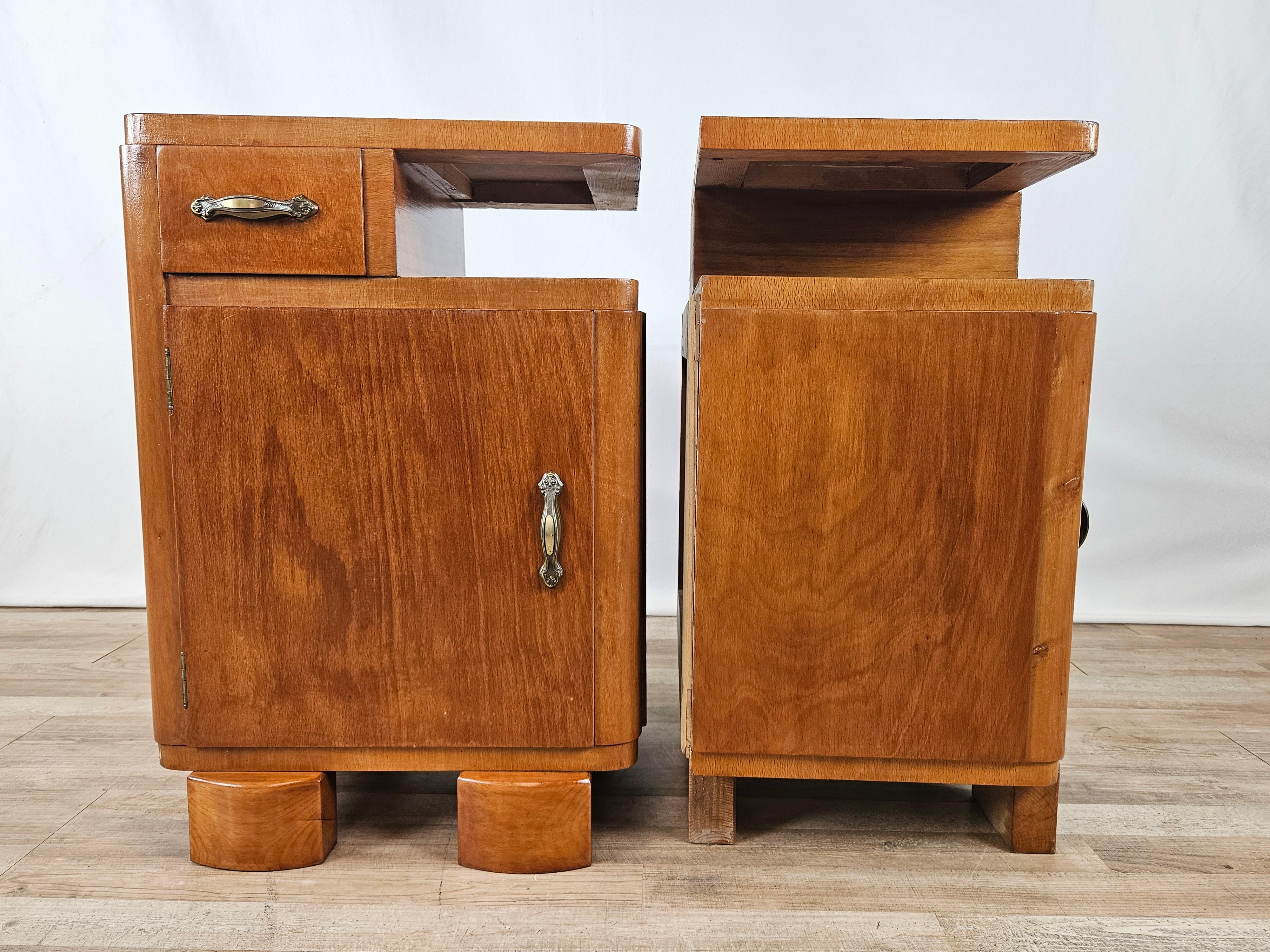 Pair of bedroom nightstands made circa 1940 entirely of wood with door and drawer.

They lend themselves well to all kinds of environments due to their small size and soft, gentle wood tone.

Brass handles placed after the furniture was