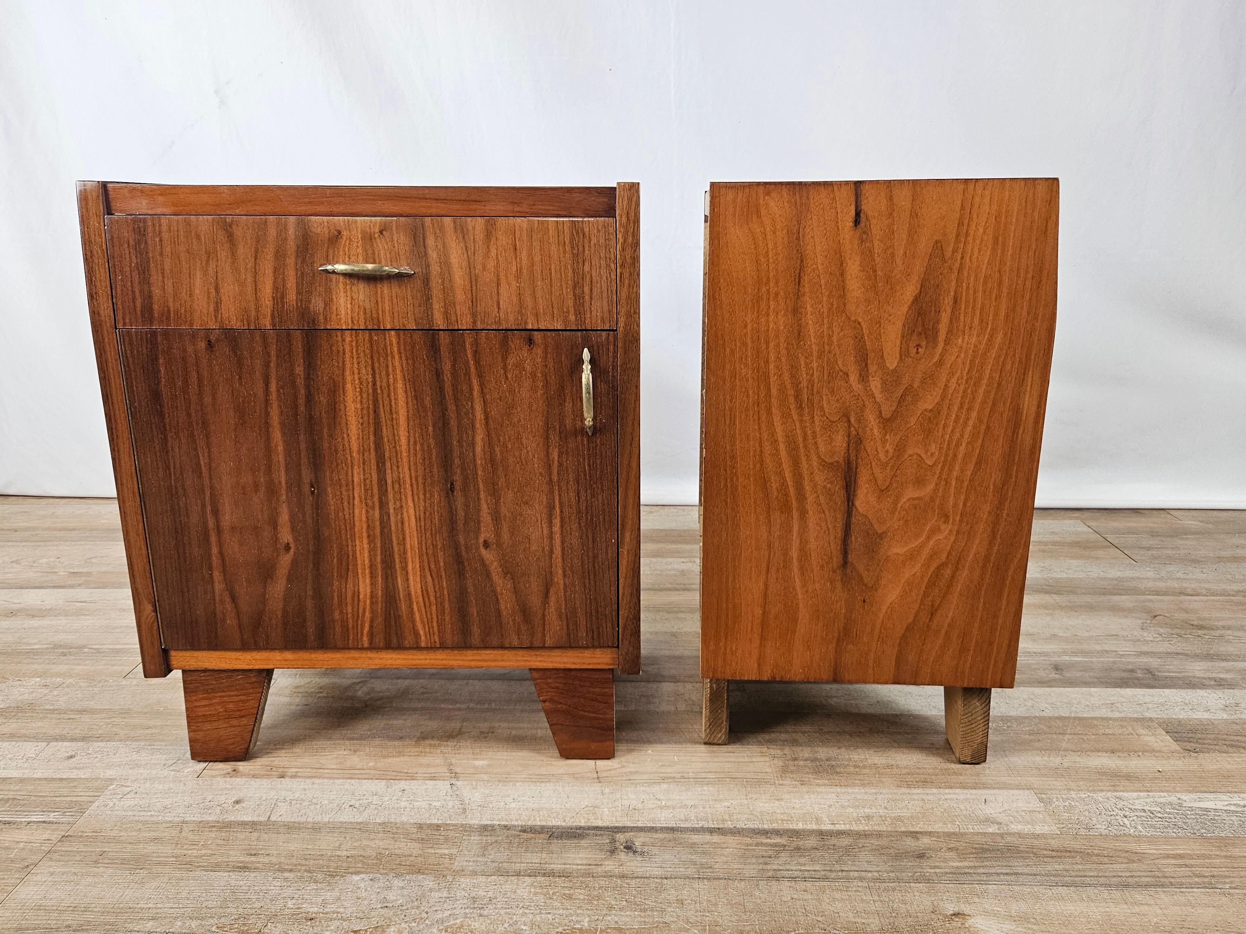 Italian-made 1950s Mid Century nightstands in polished walnut, fitted with drawer and door with interior compartment.

They show some signs of wear as pictured due to age and use.