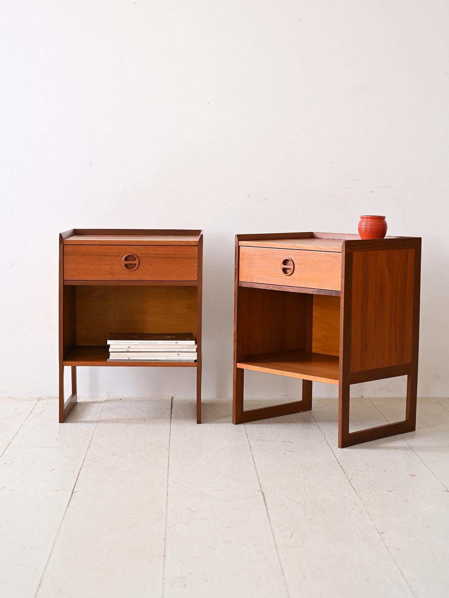Pair of 1960s nightstands that stand out for their square shape and functional design.                                                                                
Each nightstand features a sturdy structure with a handy drawer at the top, ideal