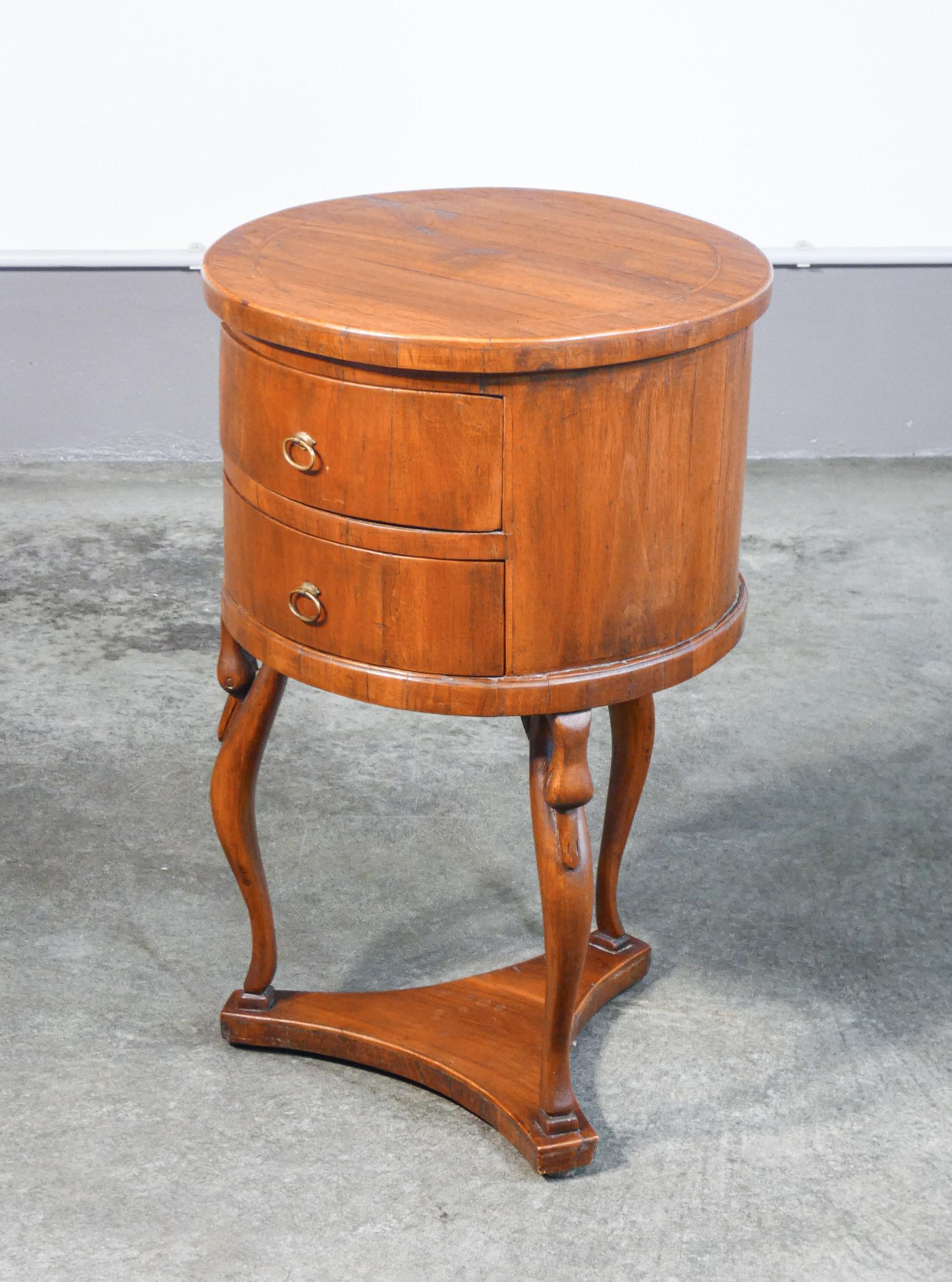 Wood Walnut Empire bedside table with two small drawers and carved legs. Nineteenth Century