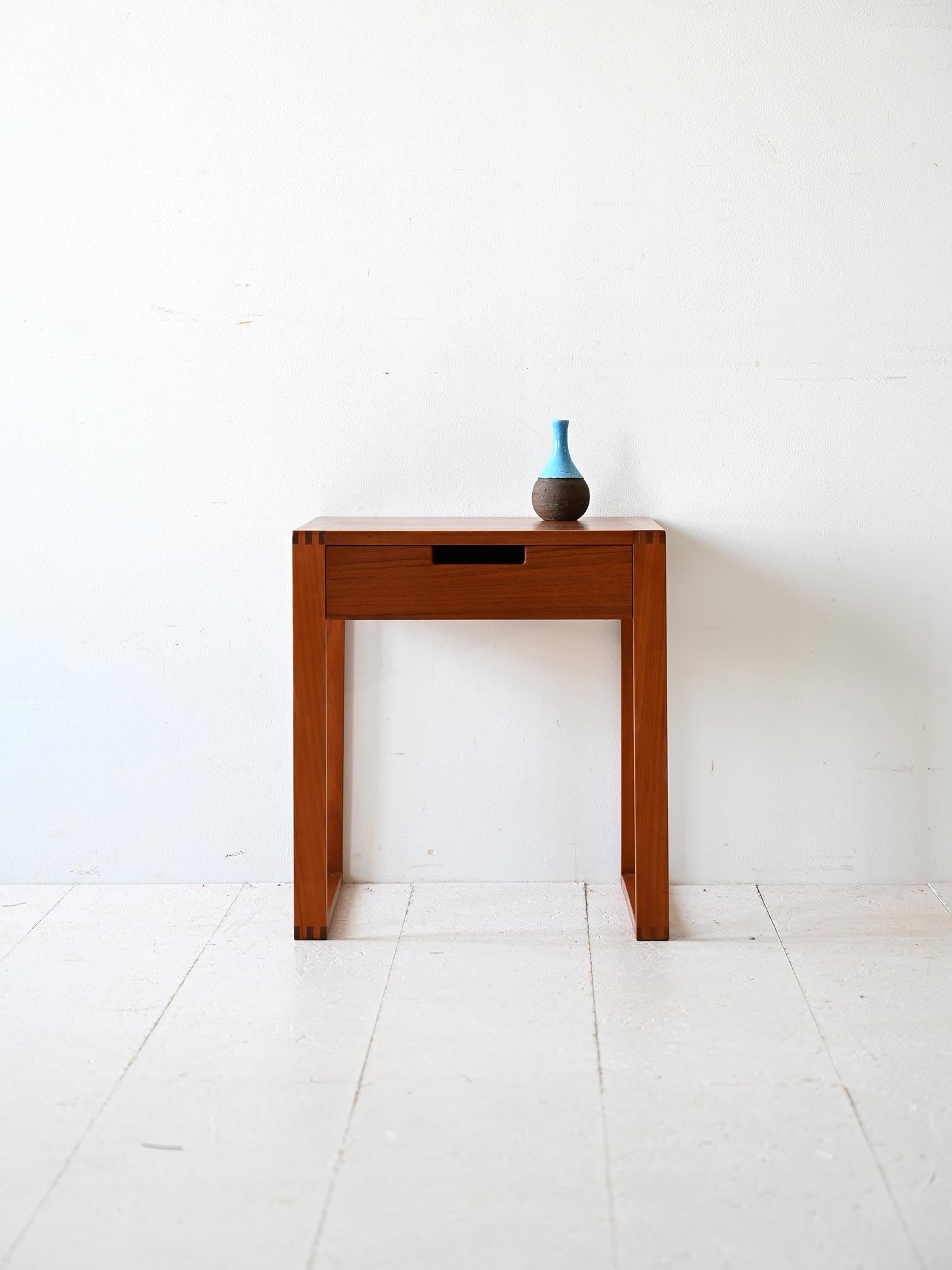 Square-shaped modern antique nightstand with drawer and dovetailed legs. 

Characterized by sleek, modern lines and sophisticated details. It can be used both as a bedside table and a side table in different rooms of the house. 
Good conditions.
