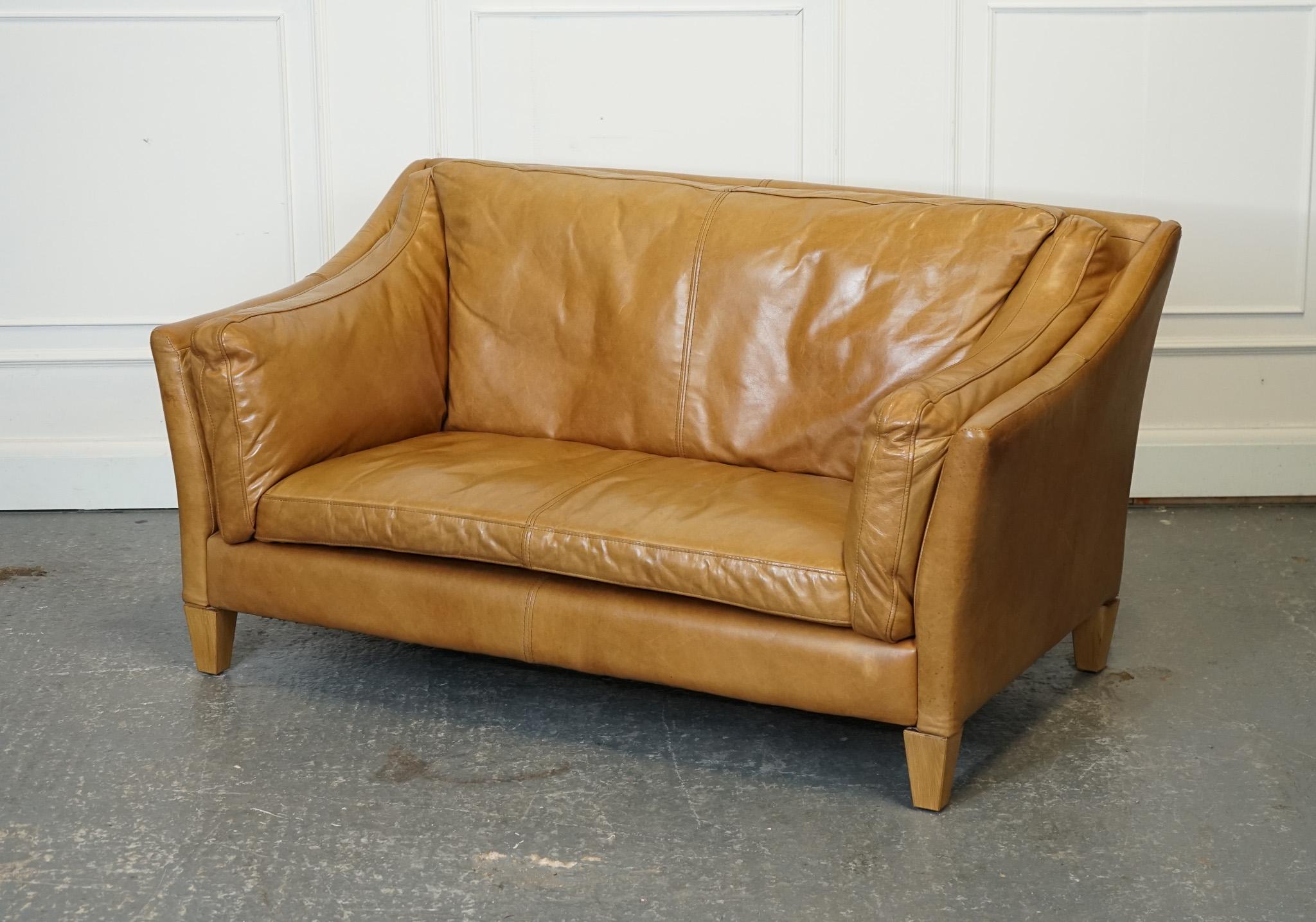 Antiques of London



We are delighted to offer for sale this Lovely Halo Reggio Tan Leather Two Seater Sofa.

The Halo Reggio Tan Leather Two Seater Sofa is a compact yet extremely comfortable piece of furniture. Made with high-quality tan leather