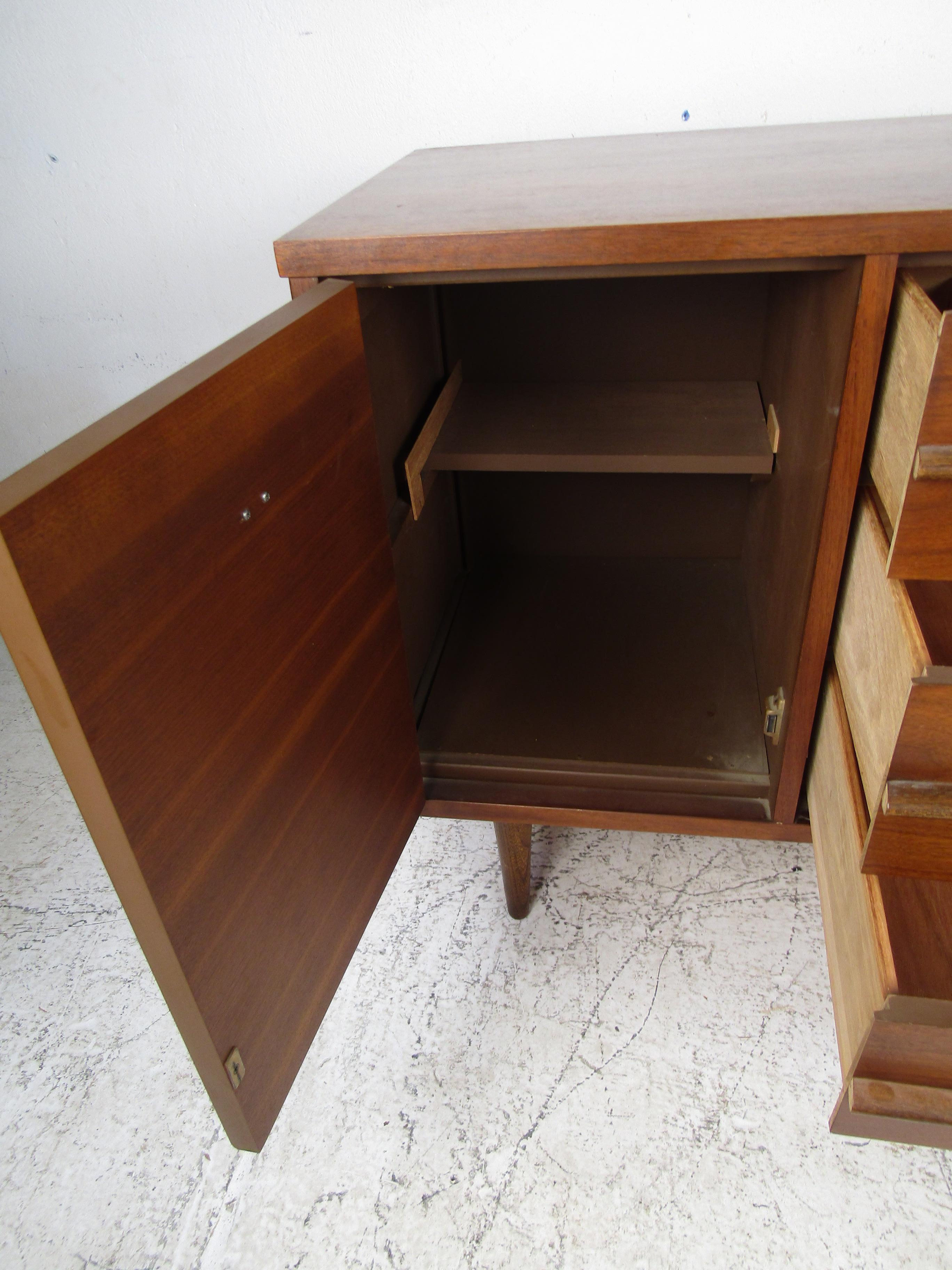 Compact Midcentury Credenza in Gunstock Walnut by Basset Furniture Inc. In Good Condition In Brooklyn, NY