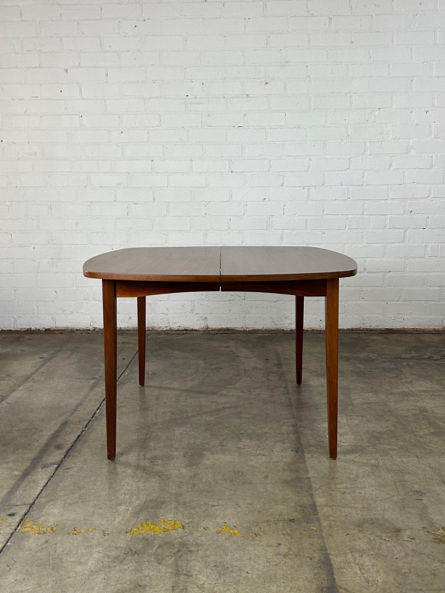 W43.5 W67 D44 H28.5 Knee Clearance 27.5 Leaf W23.5

Fully restored and structurally sound walnut dining table circa 1960s. Item shows in excellent condition with no visible chips , cracks or scratches. Table comes with one extension. 