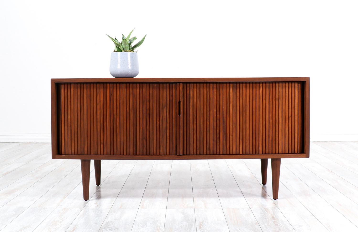 Compact Milo Baughman tambour-door credenza for Glenn of California.