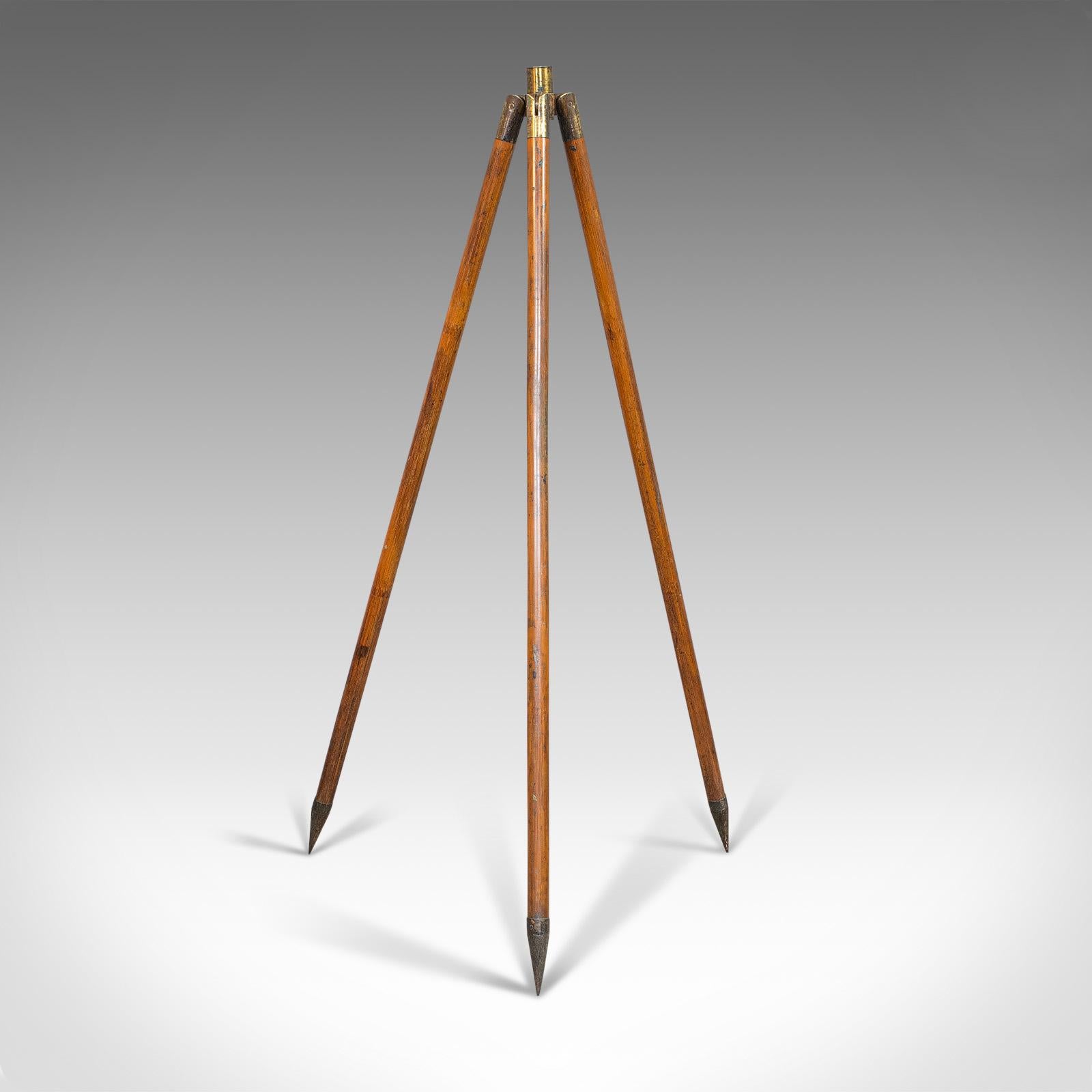 This is a compact vintage tripod. An English, bamboo and brass telescope stand, dating to the mid-20th century, circa 1950.

Displays a desirable aged patina
Eye-catching bamboo with rich hues
Dressed with brass hinges and anchor point
Socket