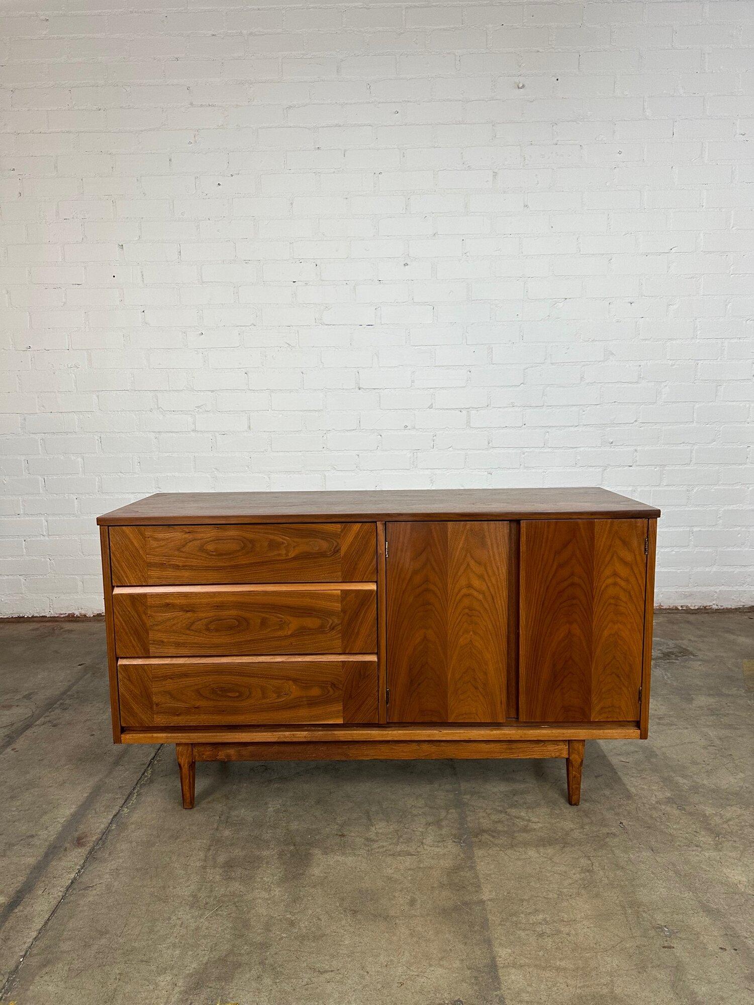 W54 D19 H31.

Fully restored walnut credenza in great condition. Item is structurally sound and fully functional with original hardware and wooden rails. Item has hidden pulls and features cross grain detail.