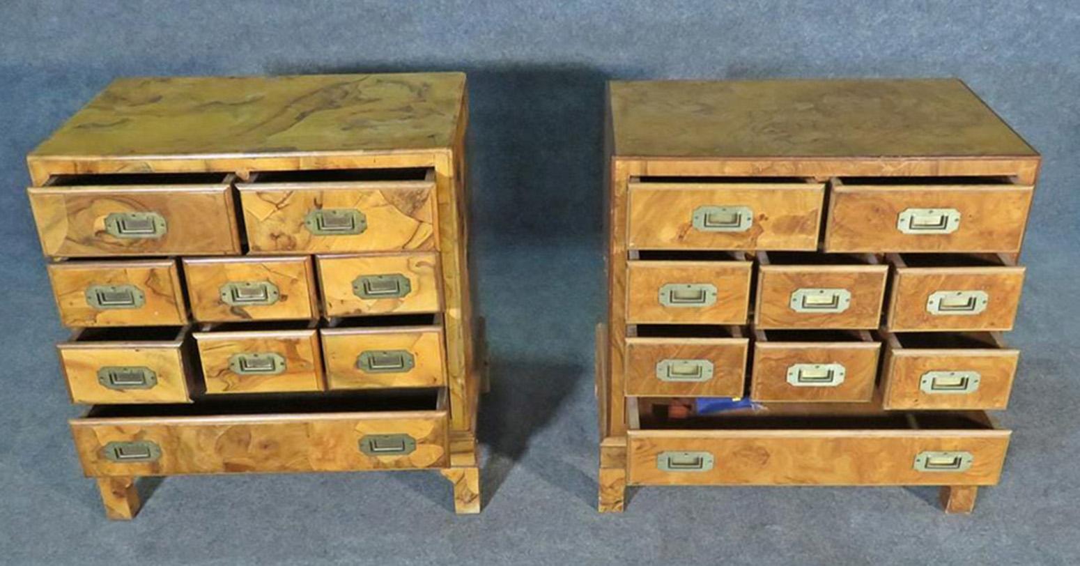 These are almost identical, except dimensions are slightly different. You may never notice when they're spaced apart in the room. The chests are made of burled walnut and date to the 1960s. They measure 26 1/2