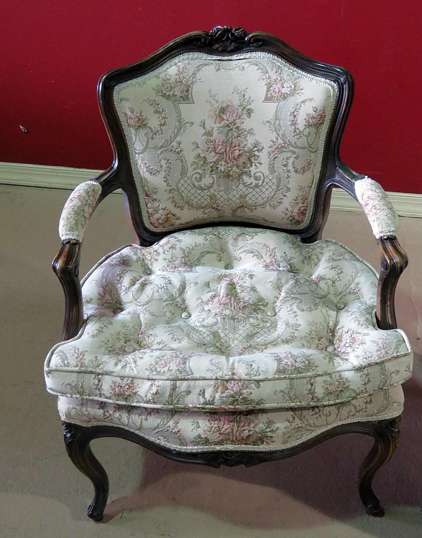 This is a beautiful companion pair of Louis XVI style carved framed fauteuils with tufted cushions. They are not an identical pair in terms of upholstery but they are as frames.