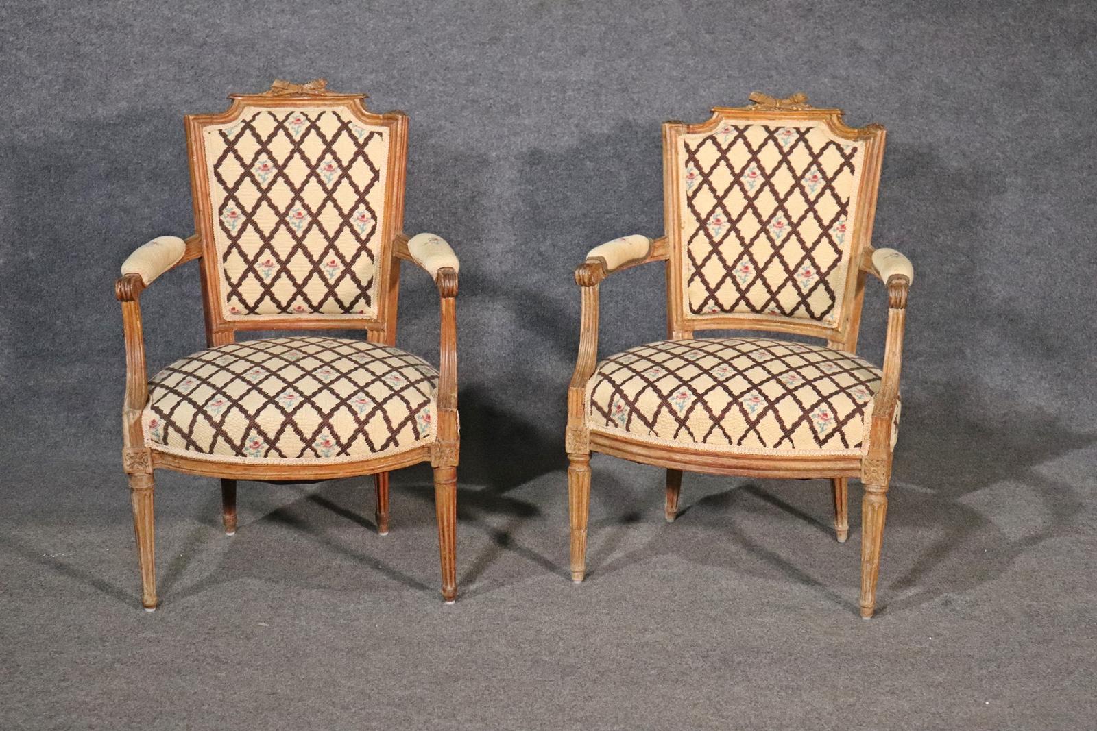 Carved wood frame and legs. Upholstered seat, back and arms. Measures: 34