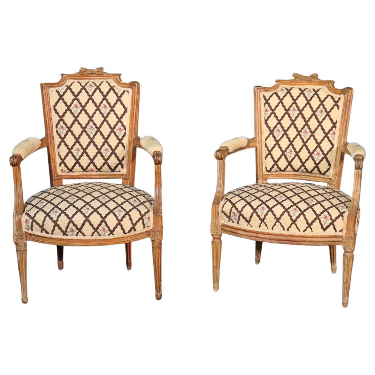 Companion Pair of Nearly Identical French Louis XVI Armchairs, Circa 1900 For Sale